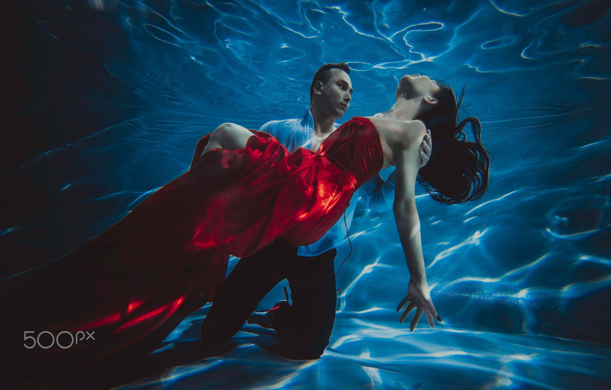 Couple dreamlike situation underwater