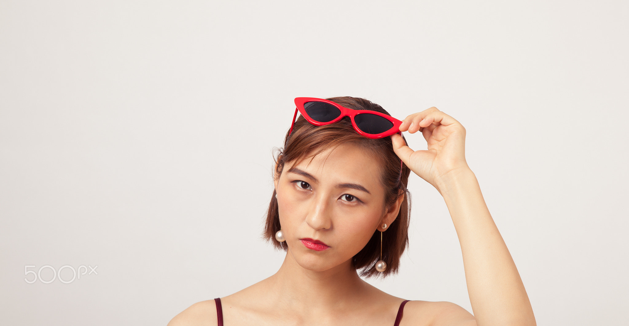Chinese Girl wearing varies types of fashion sunglasses,looking