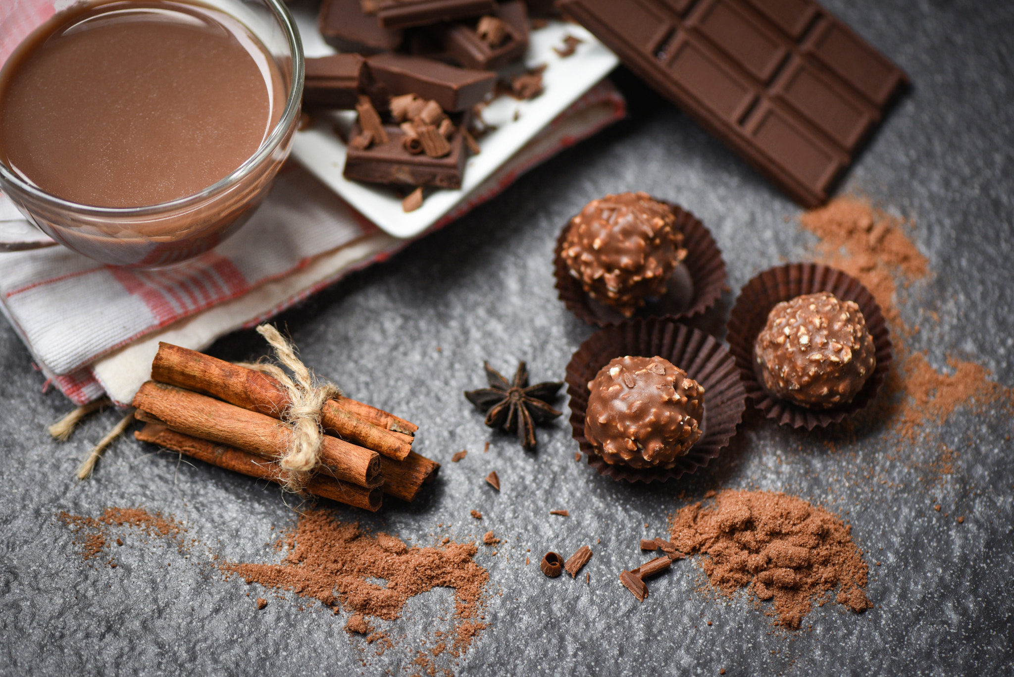 Chocolate bar and spice on the dark background / chocolate ball