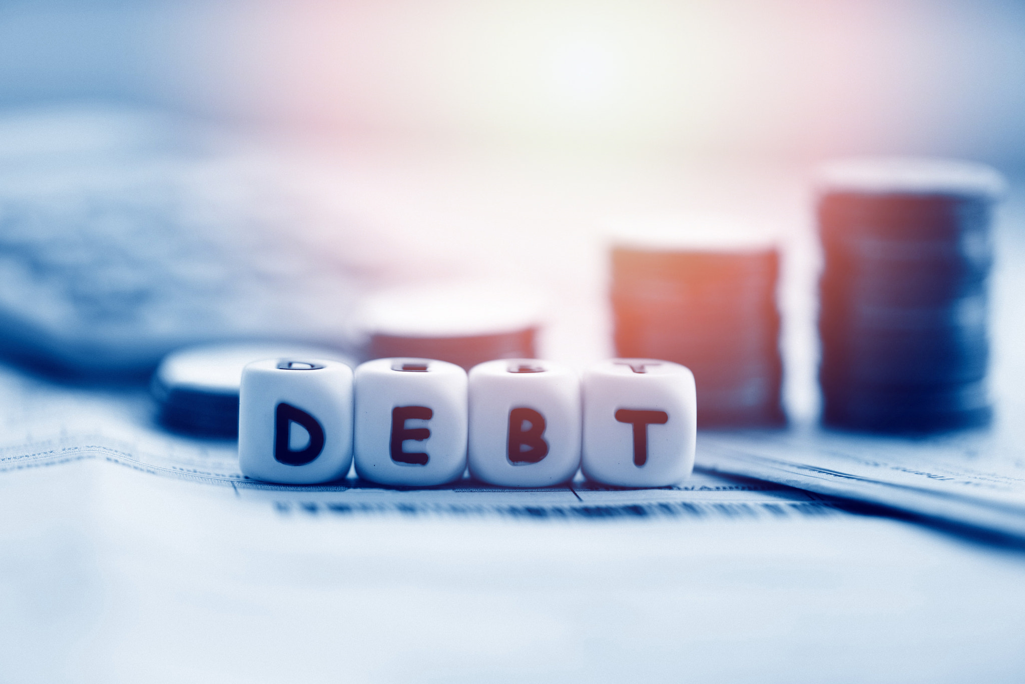 Debt credit card and money coin stack / Increased liabilities fr