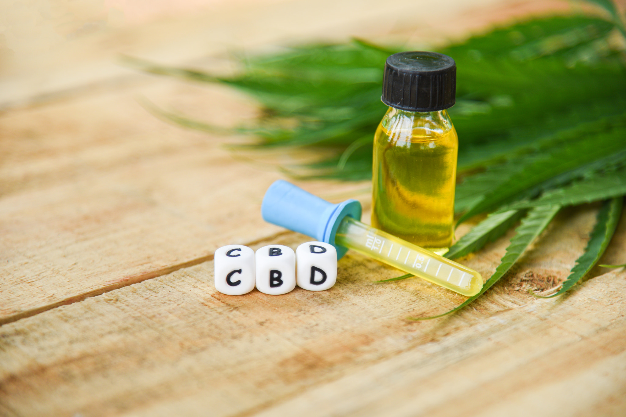 Cannabis oil on bottle products wooden background - CBD oil extr