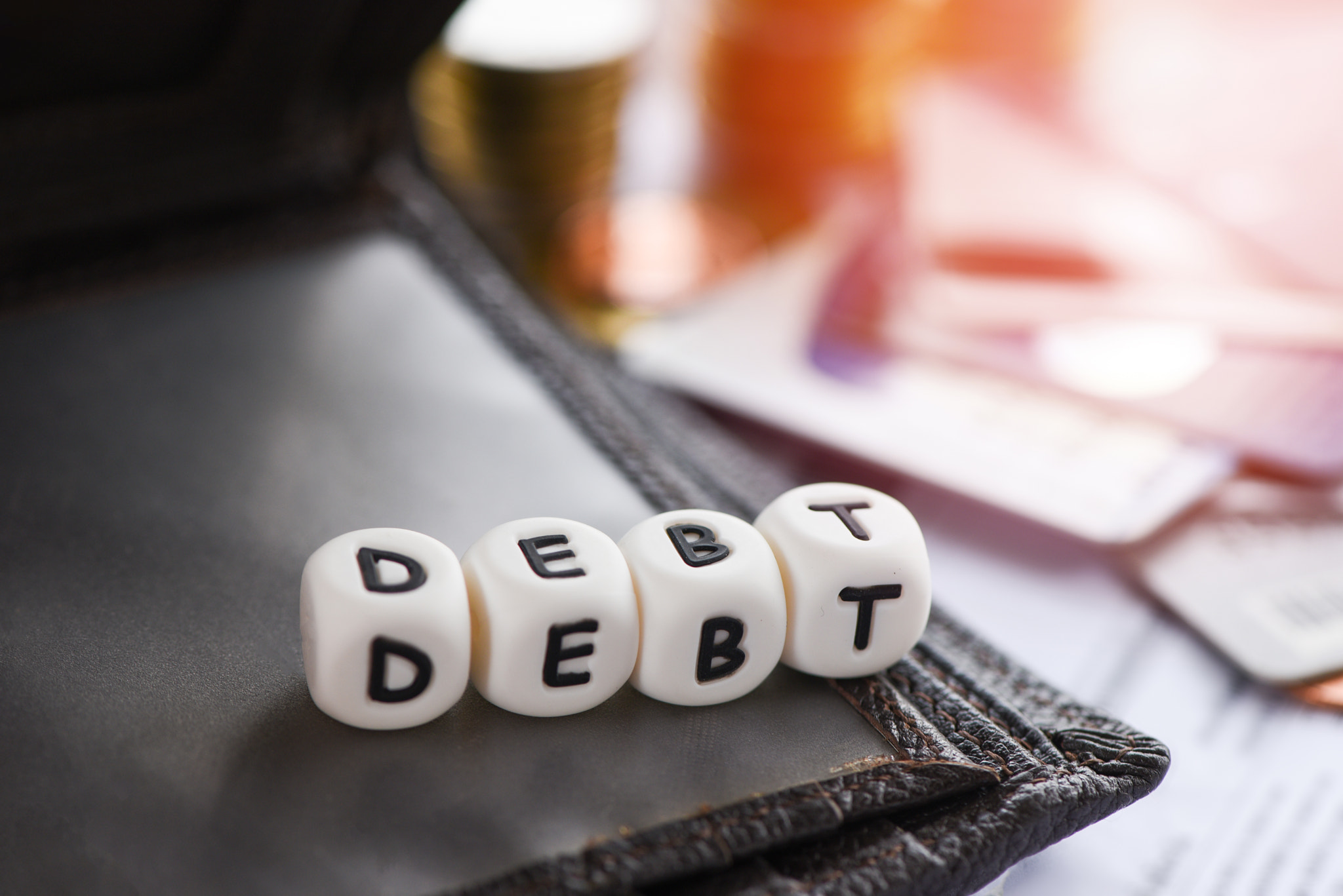 Debt credit card and money coin stack / Increased liabilities fr
