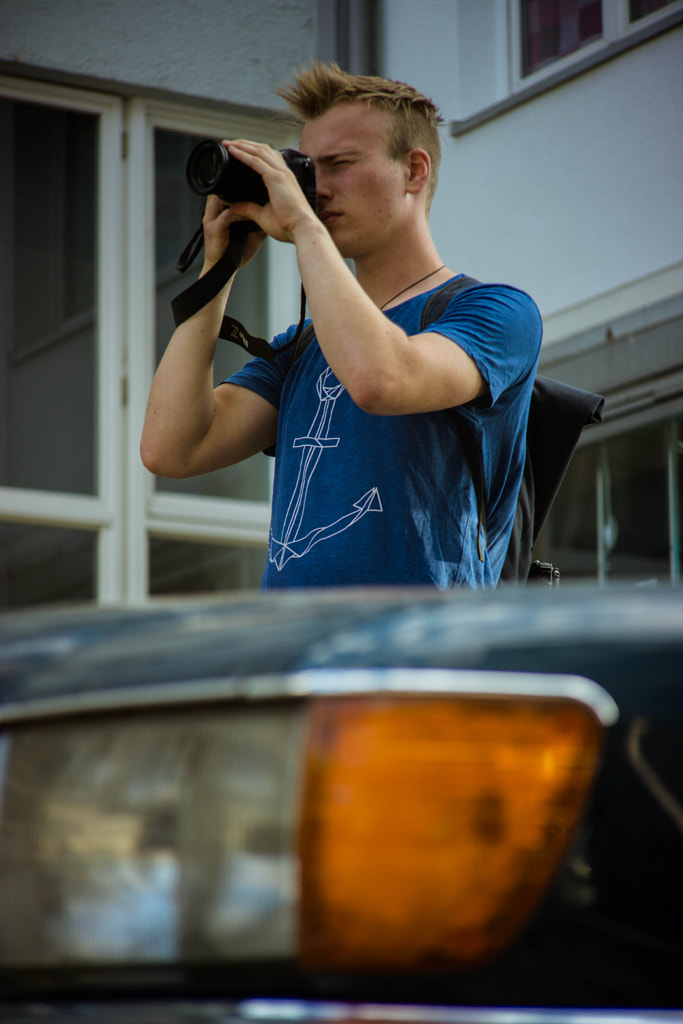 Photographer behind a car by Elias Mensing on 500px.com