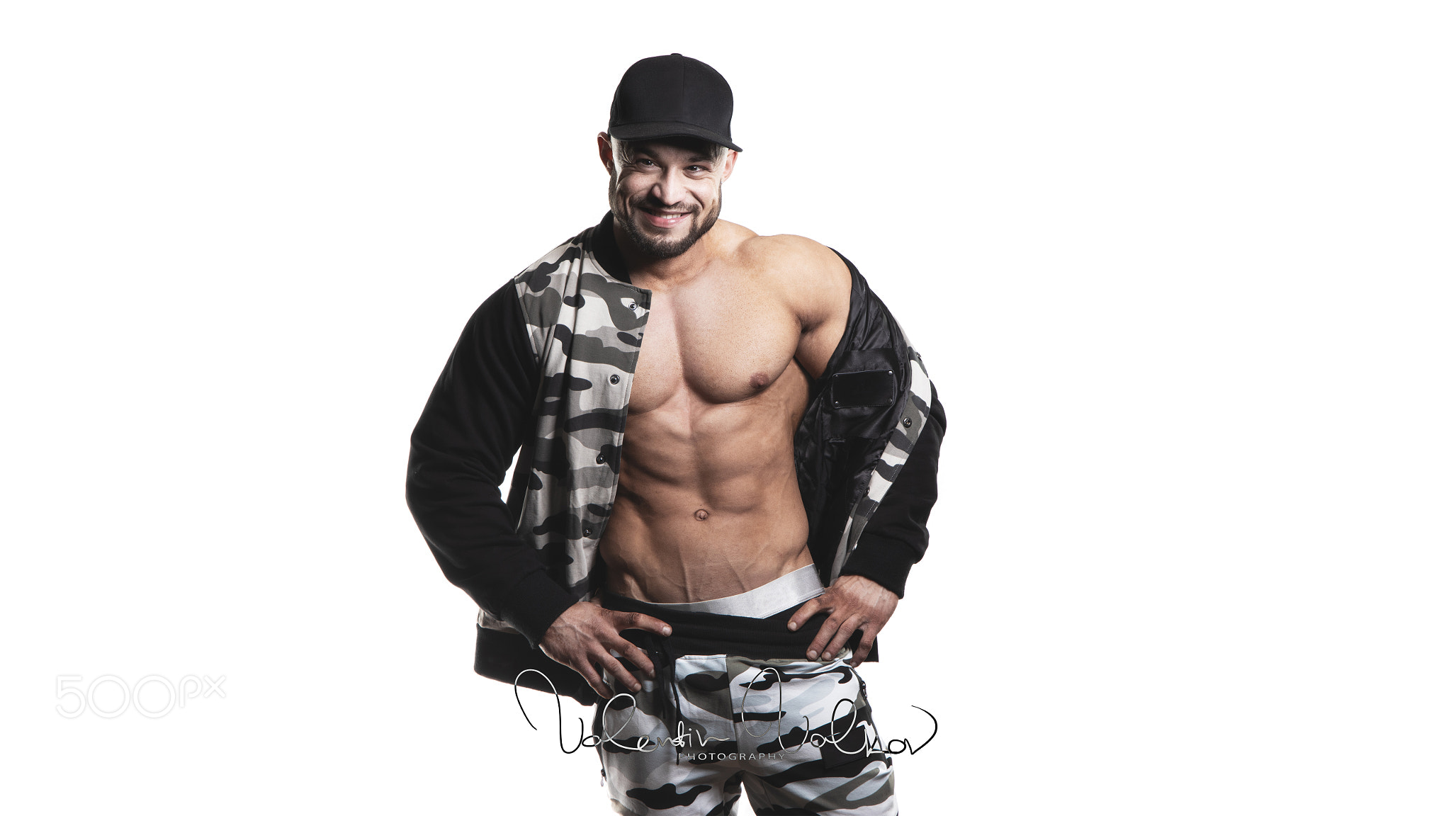 Man bodybuilder showing muscular body. Fitness and bodybuilding