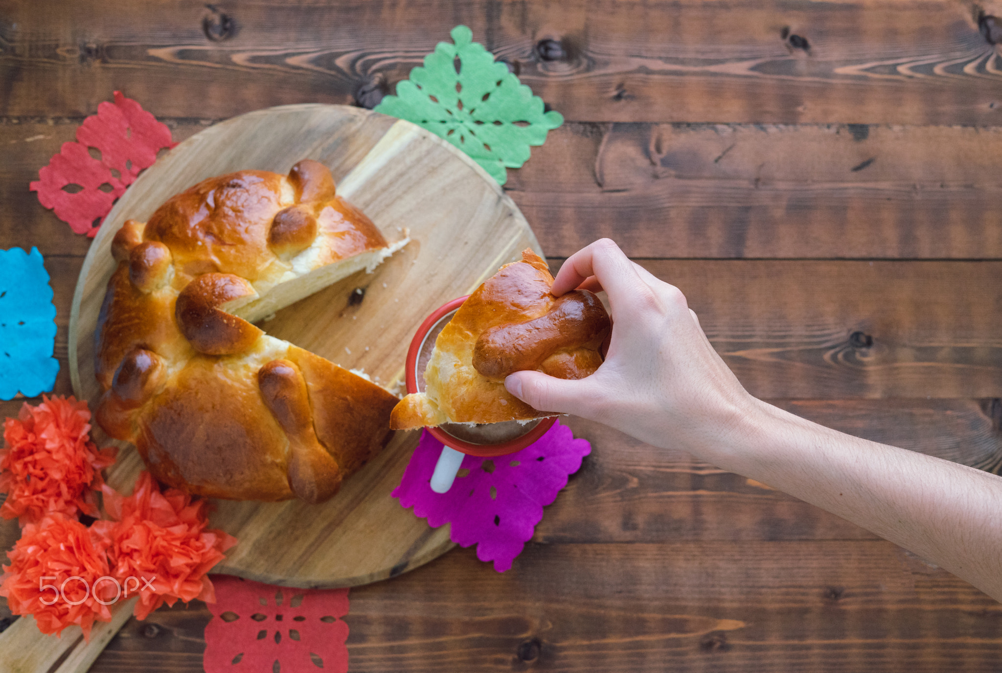 Eating dead bread with coffee with milk. Mexican parties. Day of the Dead.