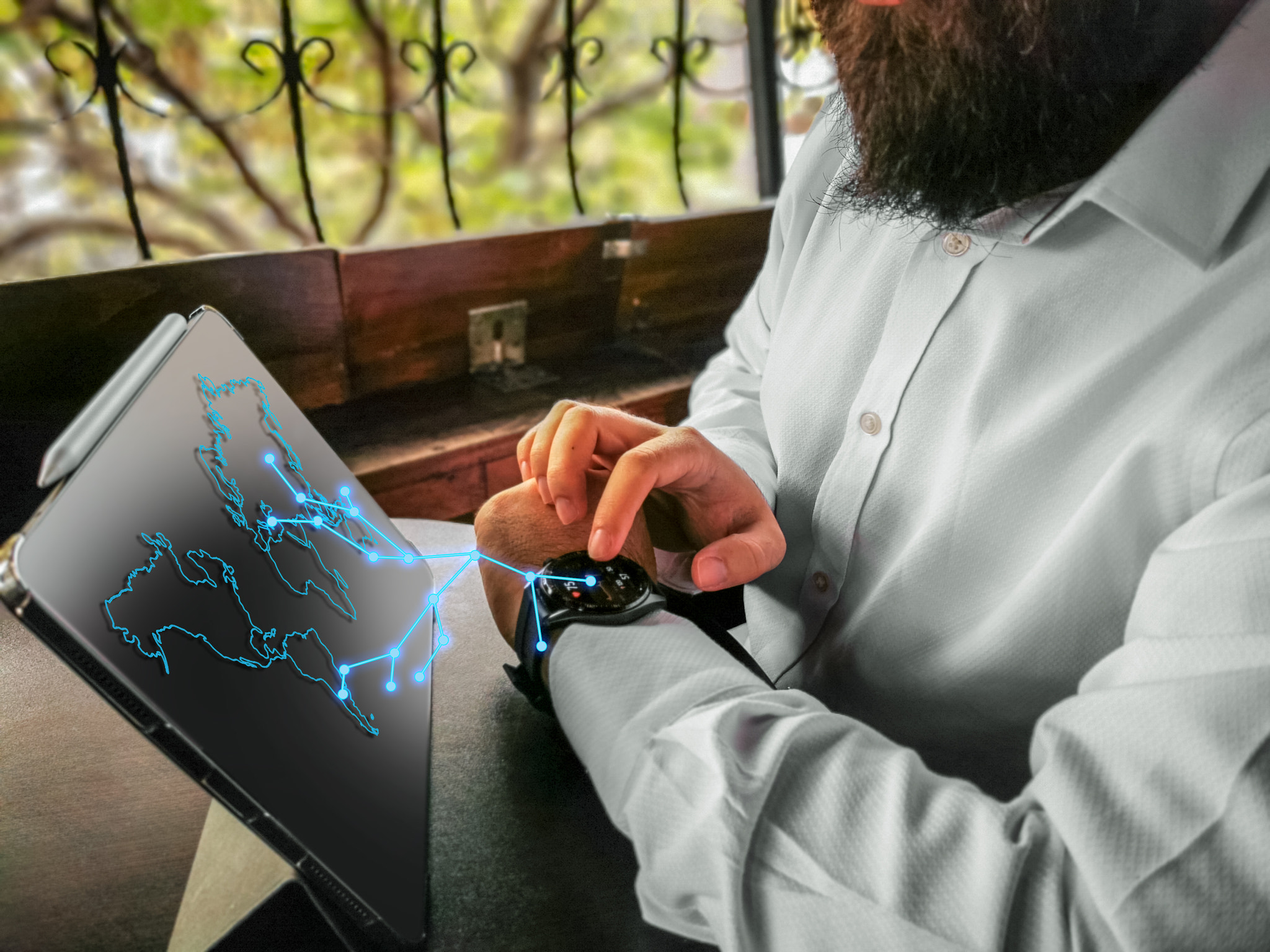 bearded adult rich businessman touching economy touching his smart watch and connecting to his pro t