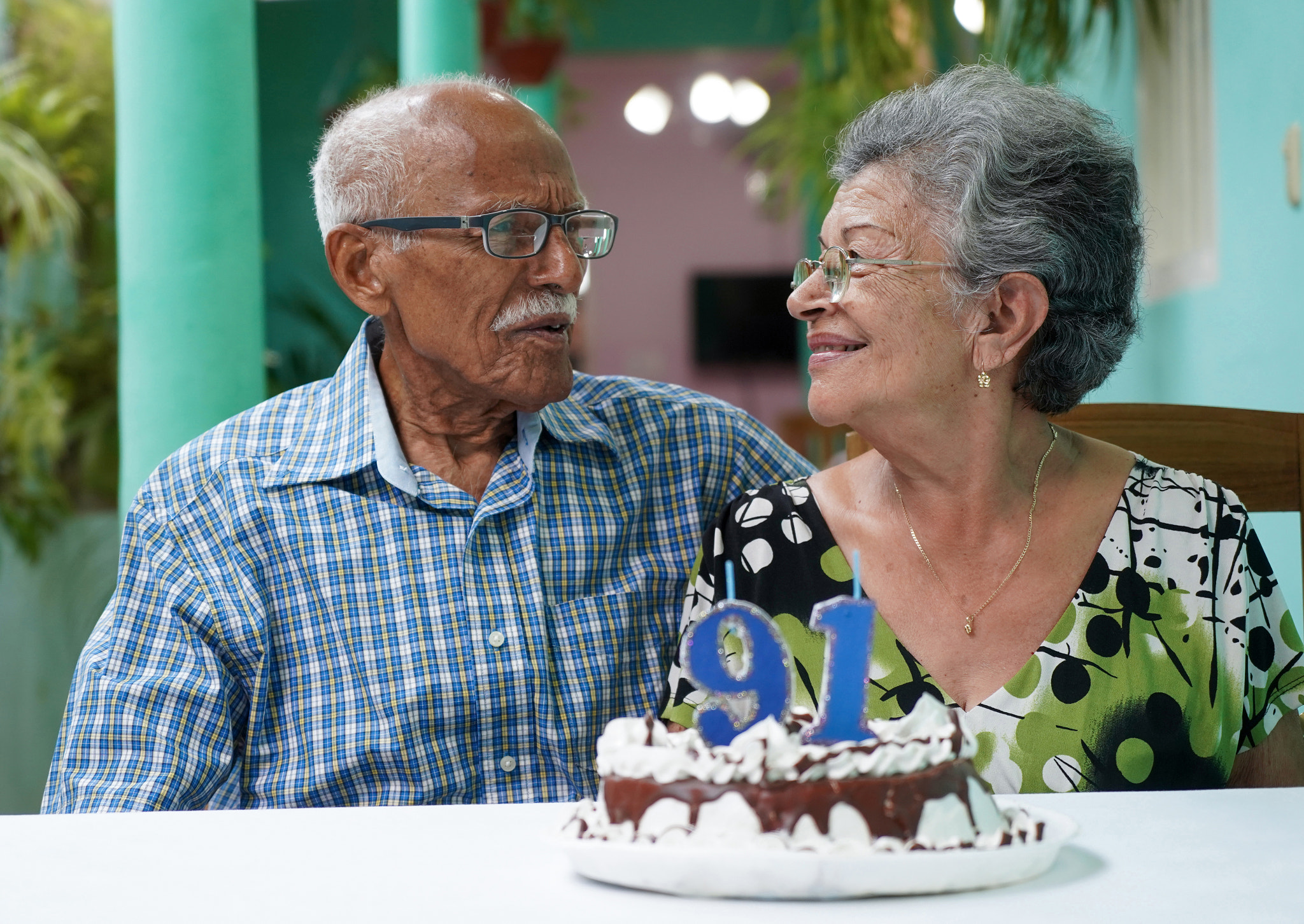 Elder couple celebrating man's 91 st birthday