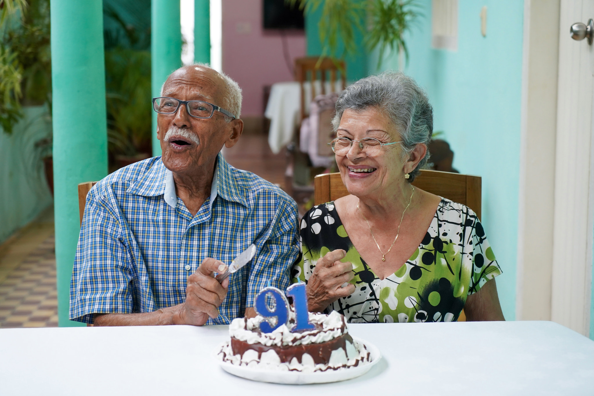 Elder couple celebrating man's 91 st birthday