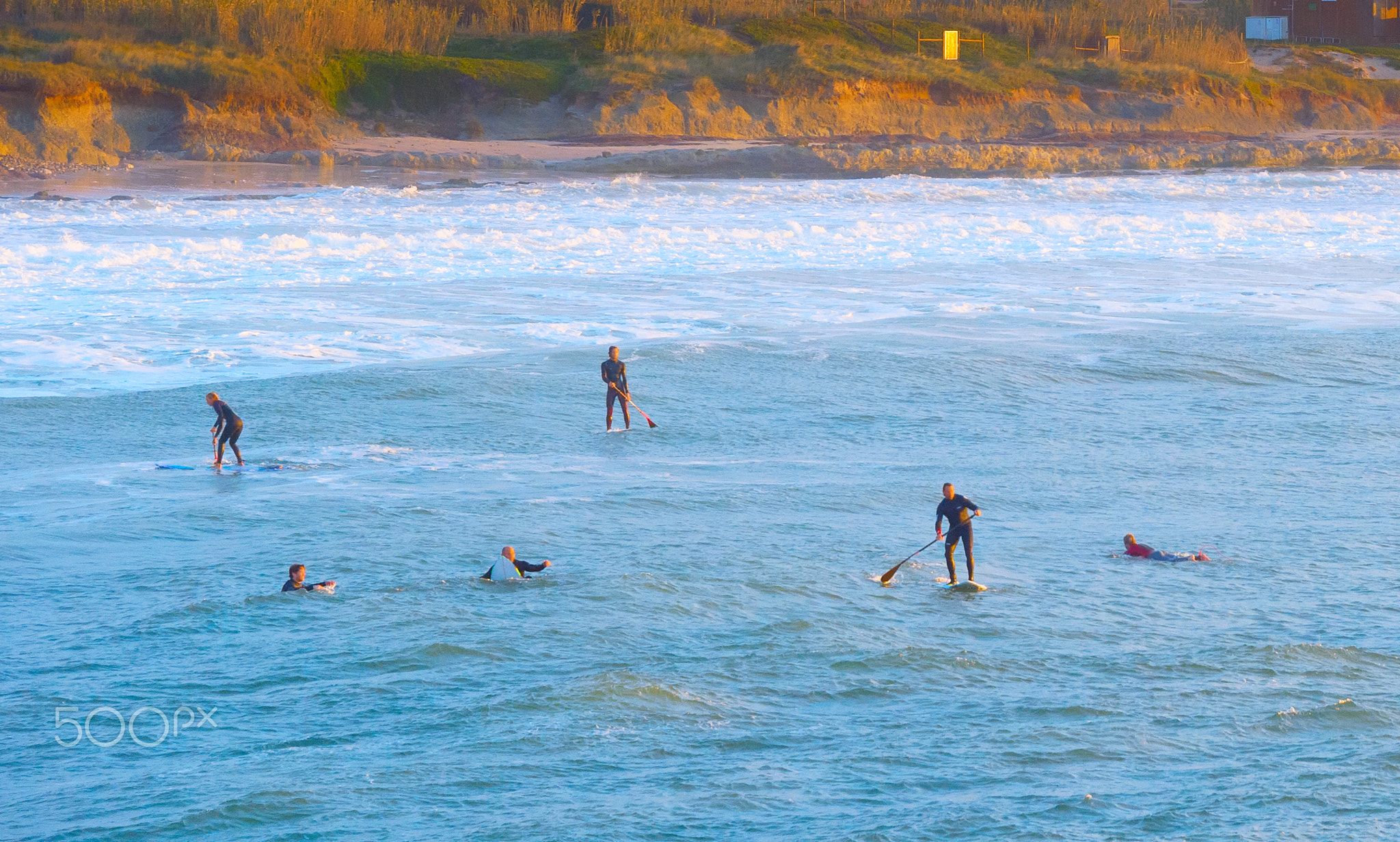 Paddle surfing ocean Peniche, Portugal