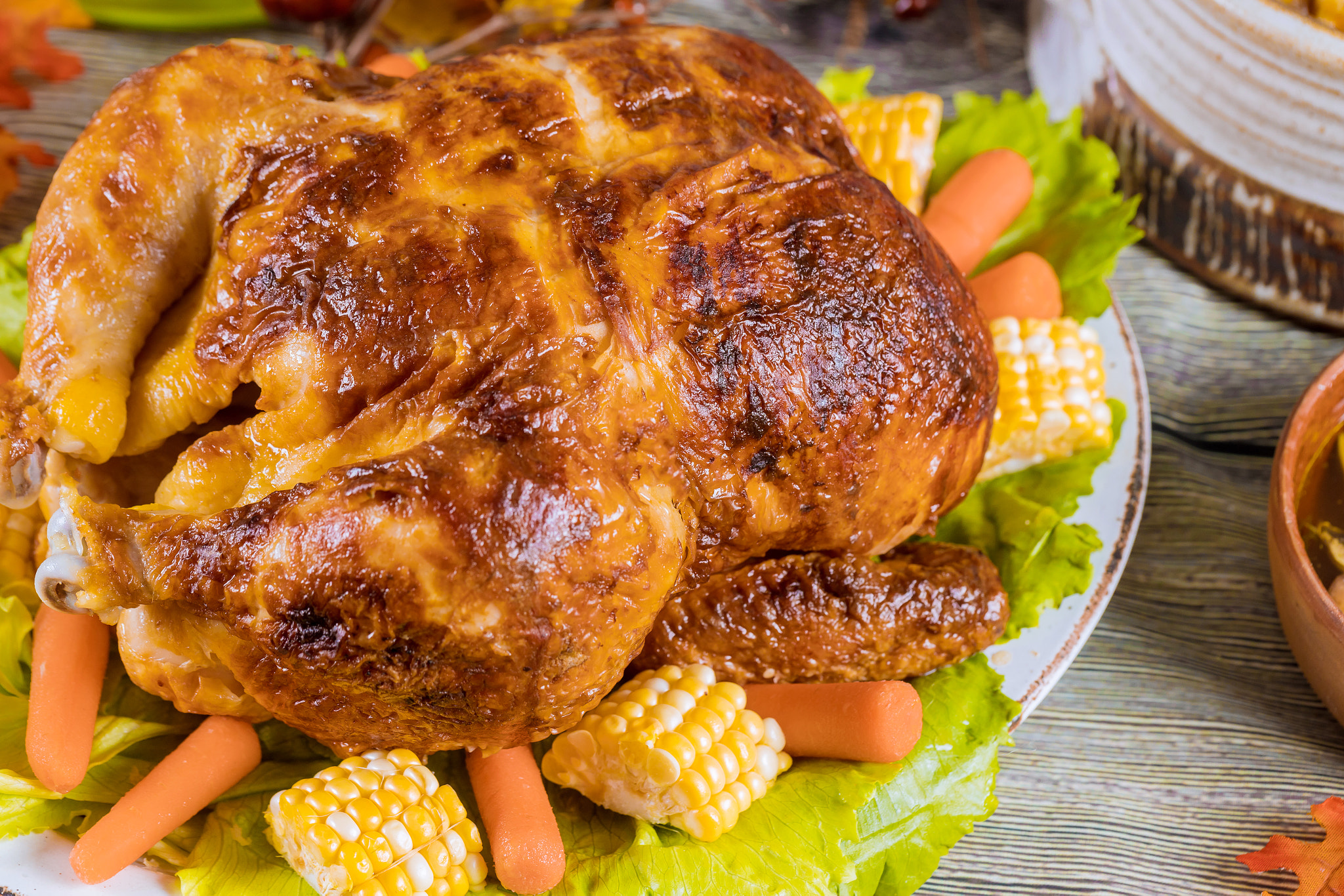 Roasted turkey dinner with corn and carrots.