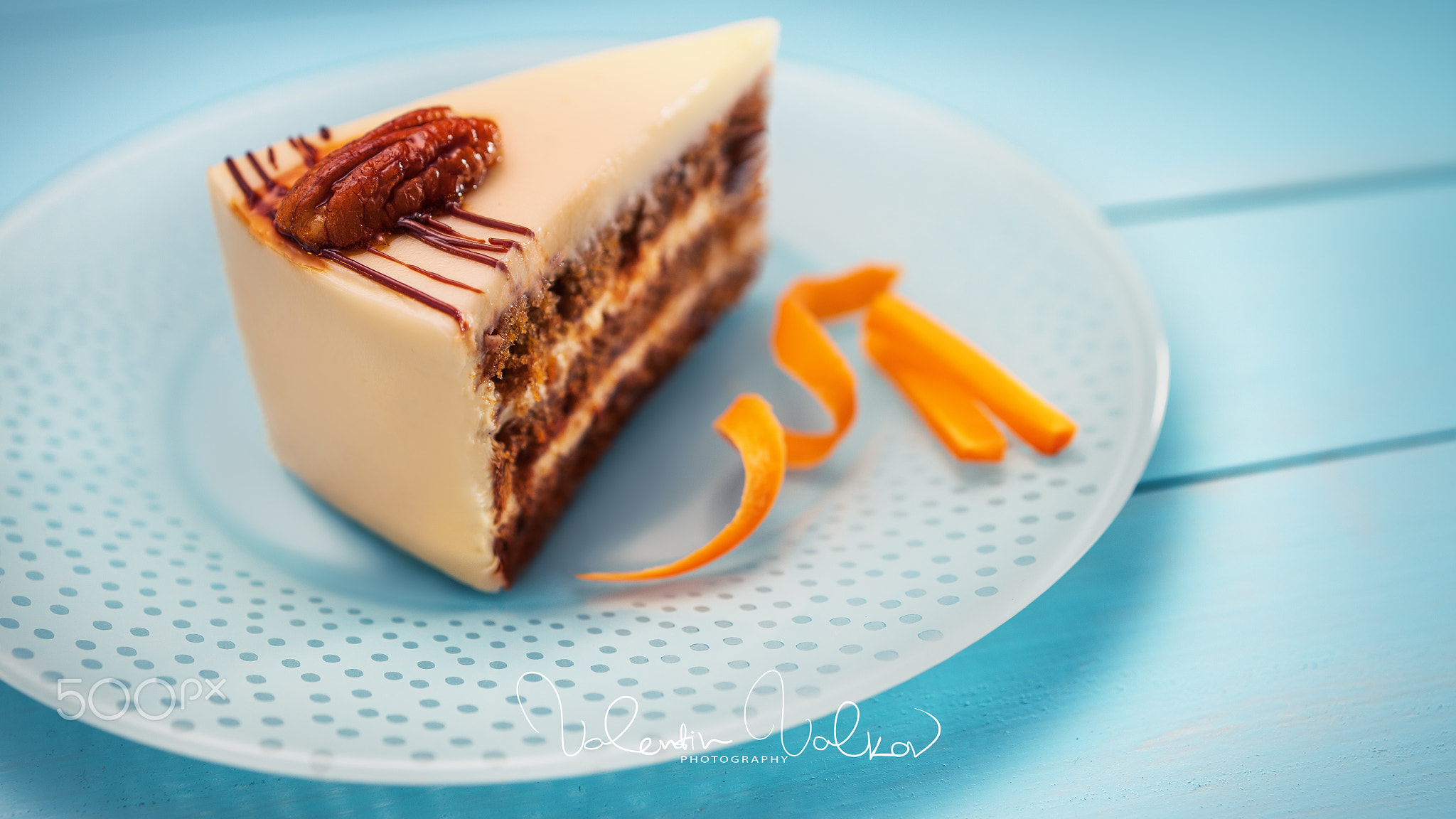 Cake piece with chocolate, milk cream, carrots and nuts isolated