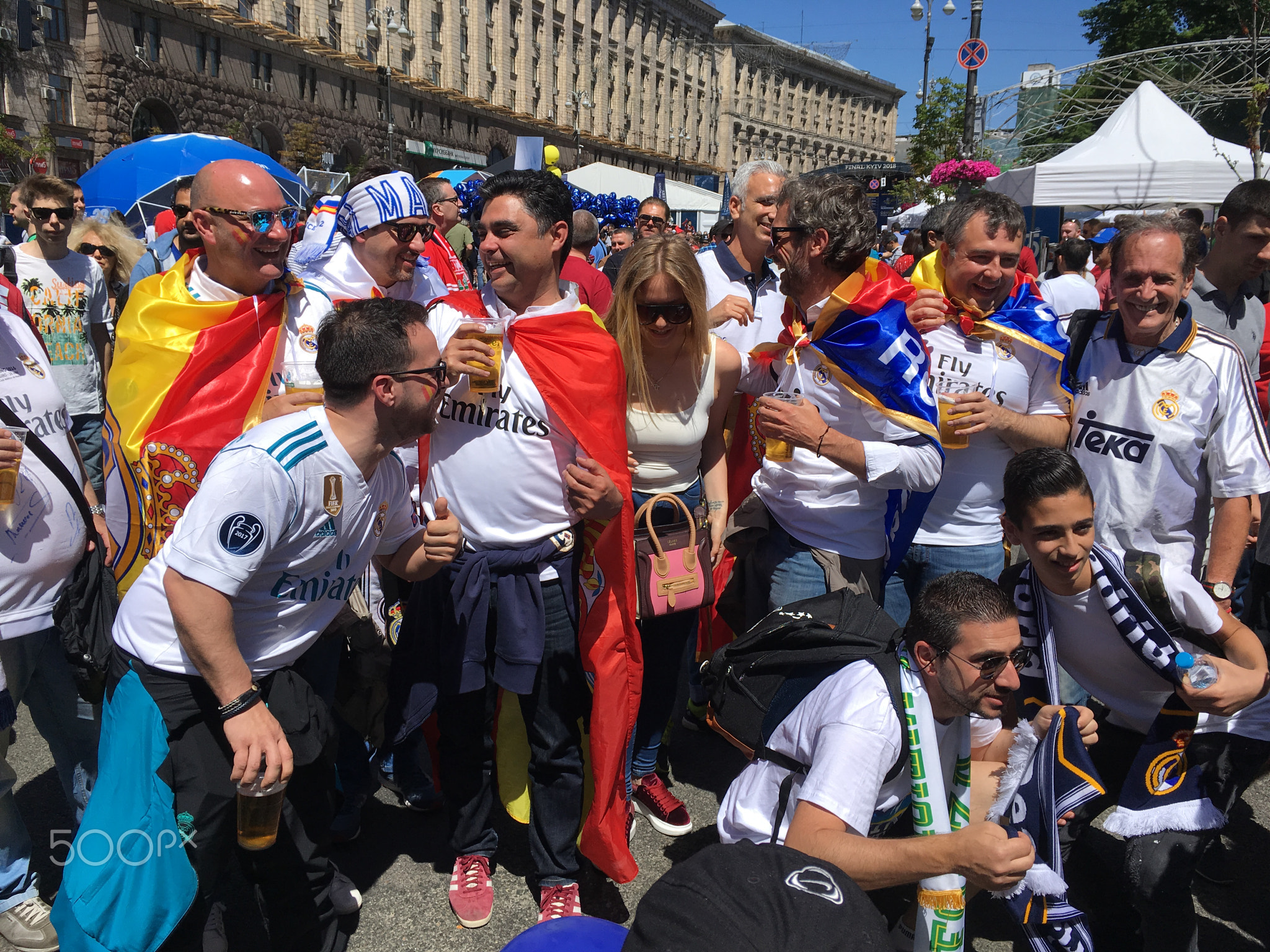 Spanish fans taking photo with people in fan zone