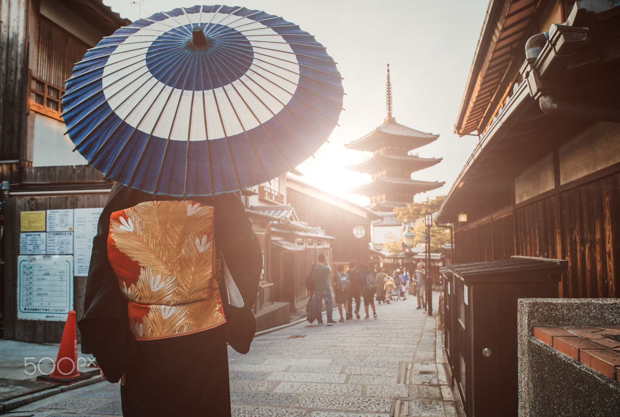 Beautiful japanese senior woman walking in the village. Typical