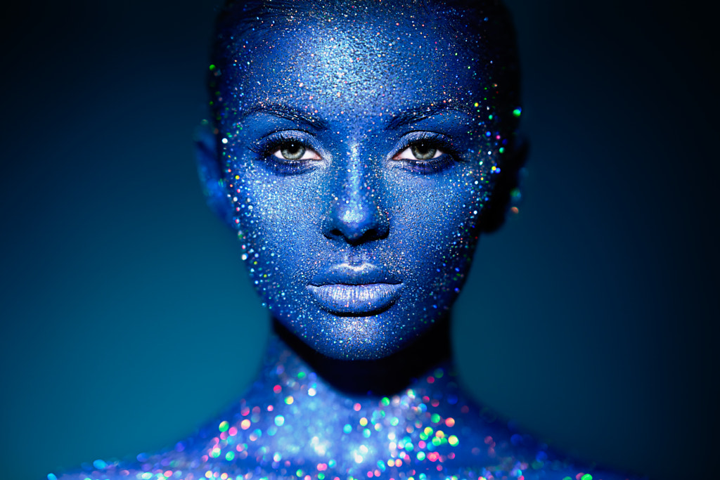 Portrait of beautiful woman with sparkles on her face by Oleg Gekman on 500px.com