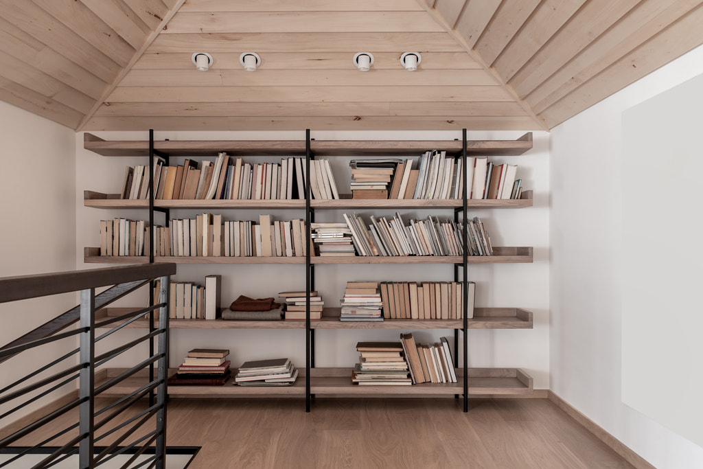 Light modern interior with sloping wooden ceiling by Andrey Bezuglov on 500px.com