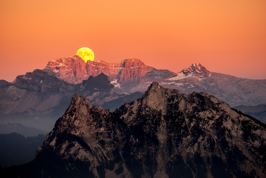 Moonrise during sunset, captured on mount gnipen, Switzerland by Christian Albisser on 500px.com