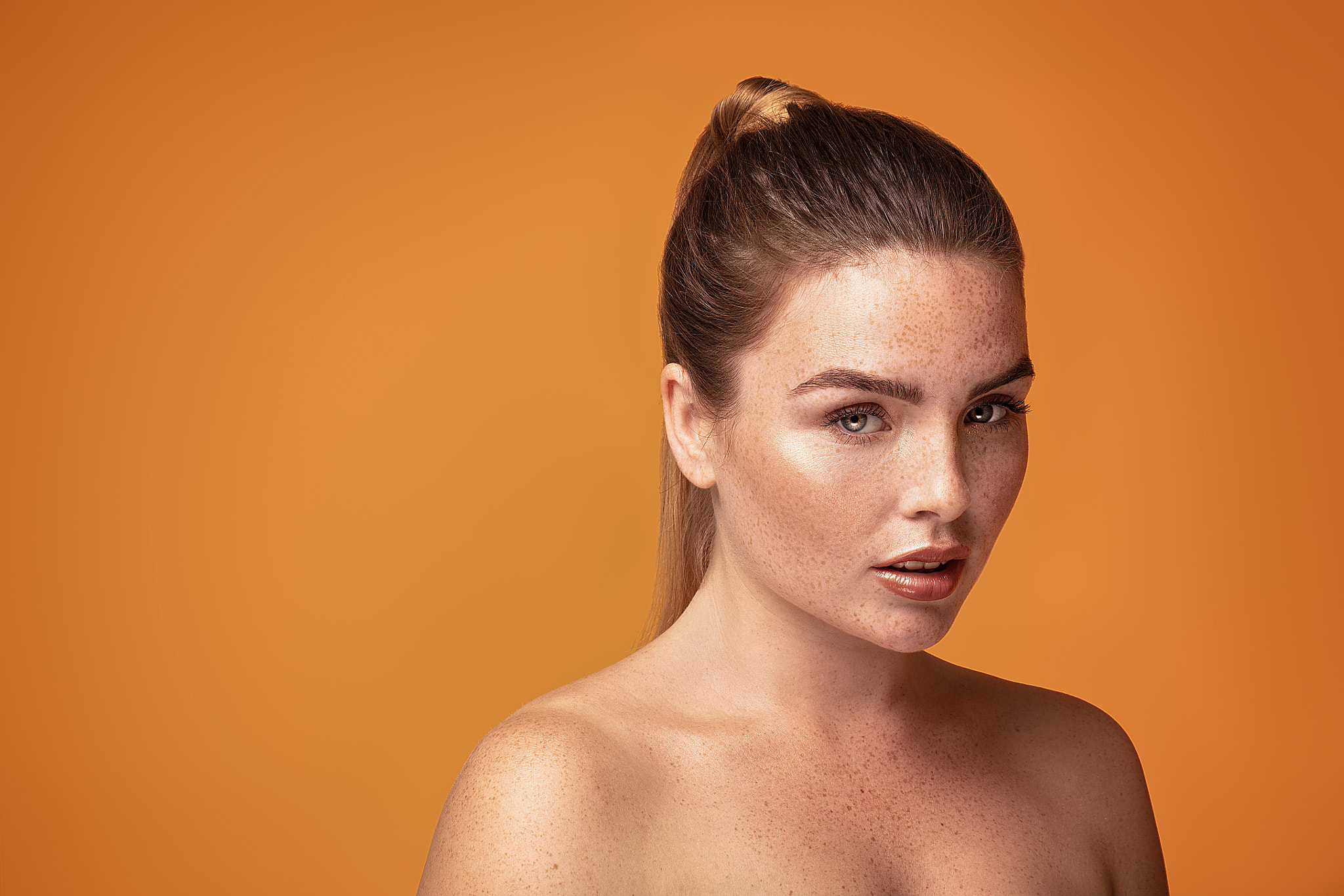 Beauty portrait of woman with freckles.