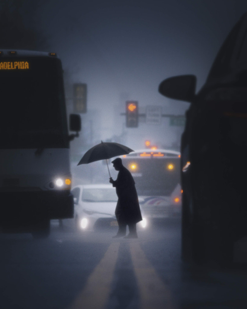 Rainy walker long focal length framed in cars by Christopher Hytha on 500px.com