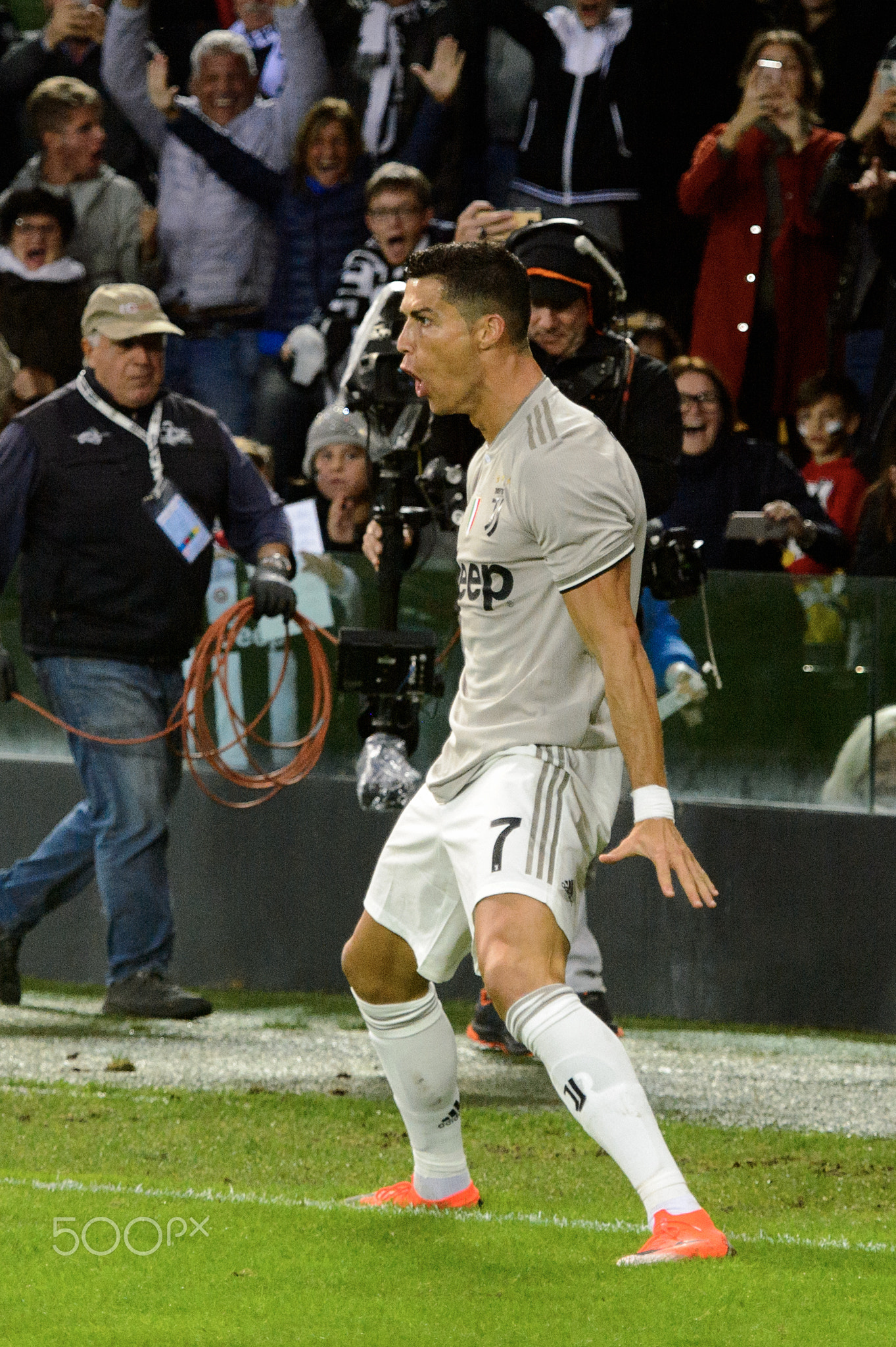 UDINE, ITALY - OCT 6, 2018: Cristiano Ronaldo celebrates his goal in his famous jump. Udinese - Juve