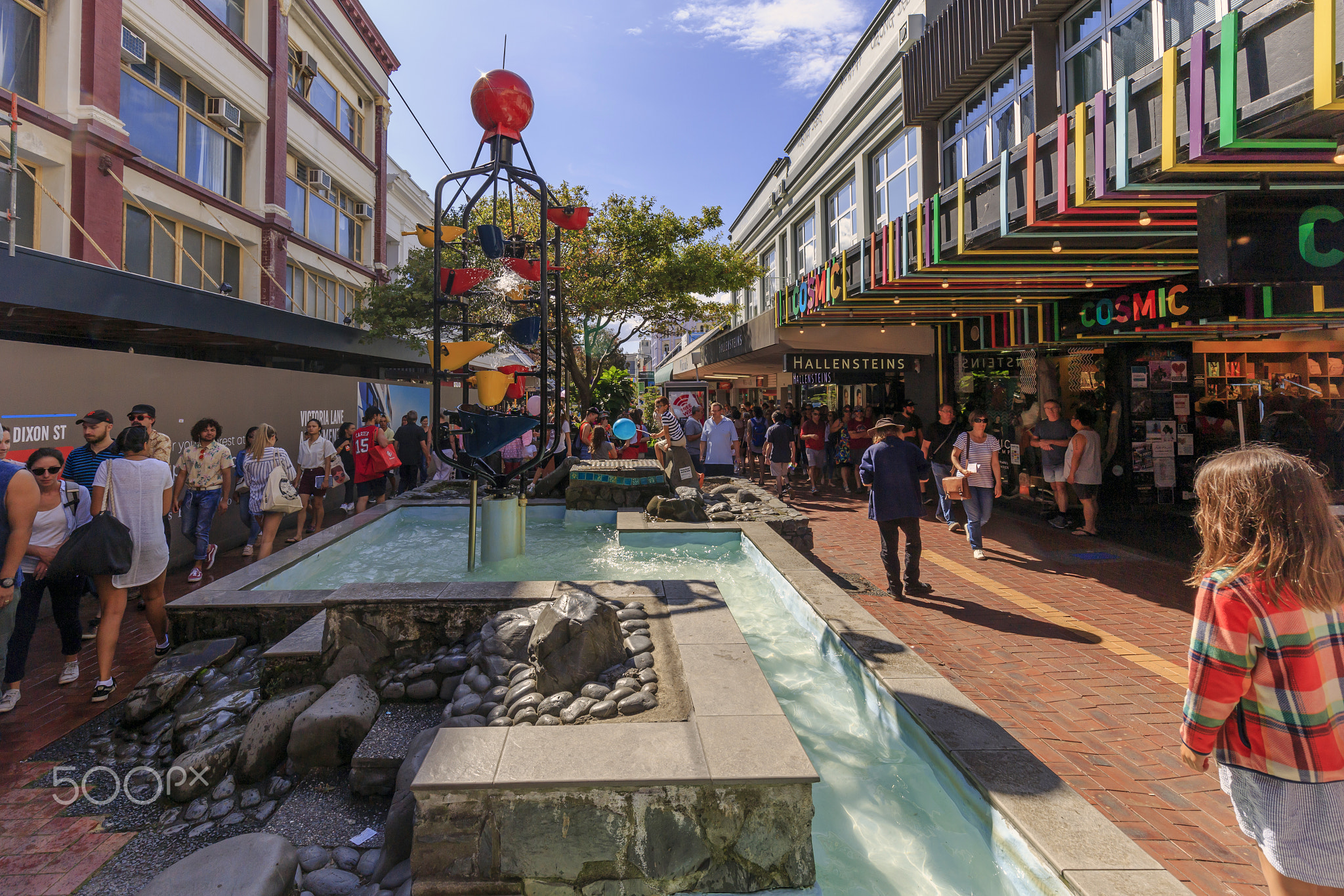 Wellington, New Zealand - March 30, 2019: People pass by the Bucket Fountain at Cuba Dupa Festival 2