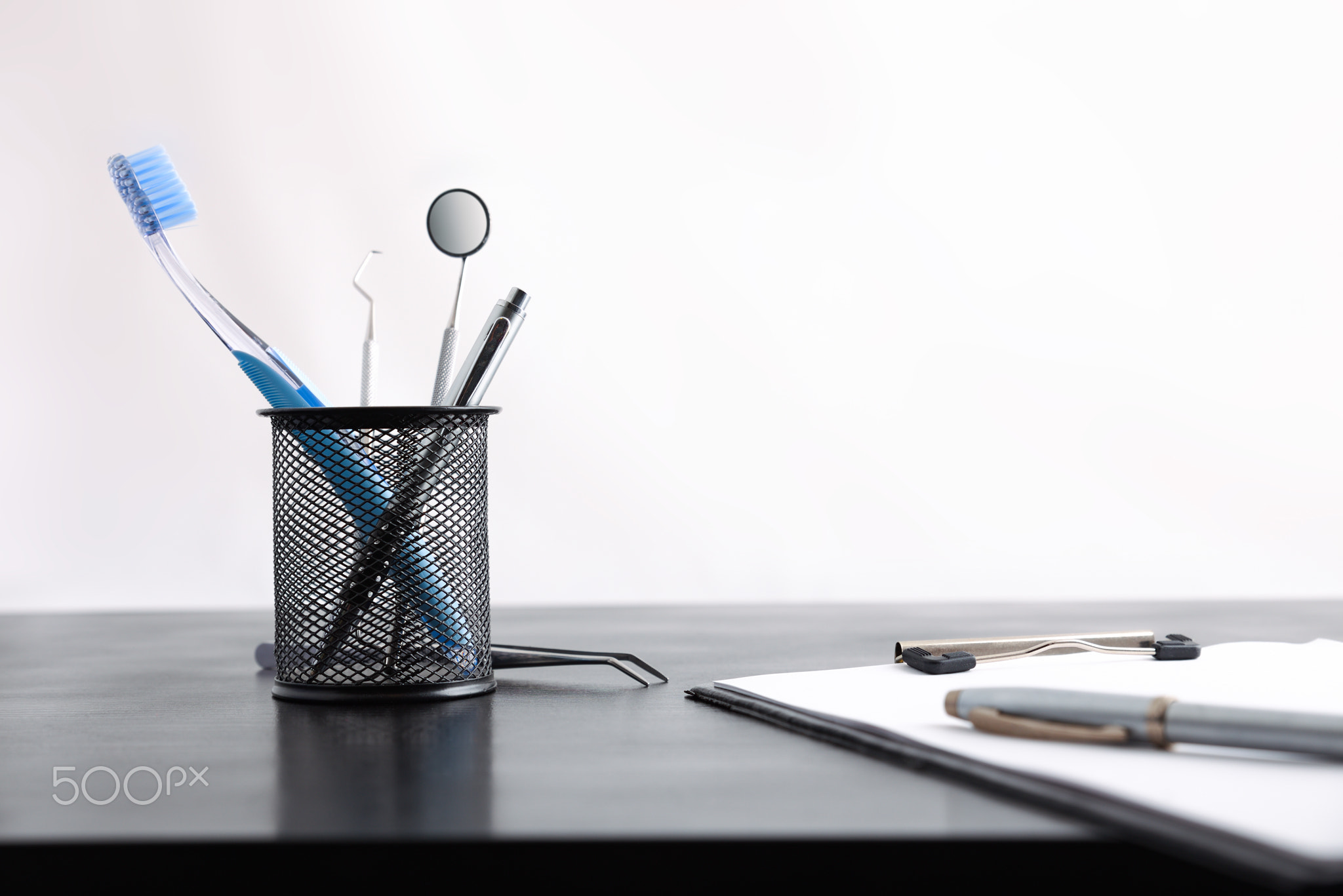 Dentist desk with office and dental supplies front view isolated