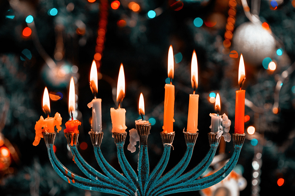 Hanukkah menorah with burning candles by valentyn semenov on 500px.com