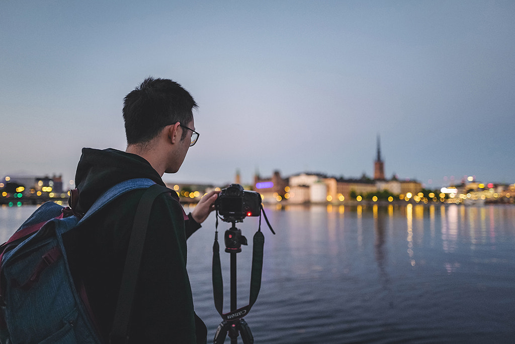 Photographer taking photos with Riddarholmen urban skyline at sunset Stockholm Sweden by Lingxiao Xie on 500px.com