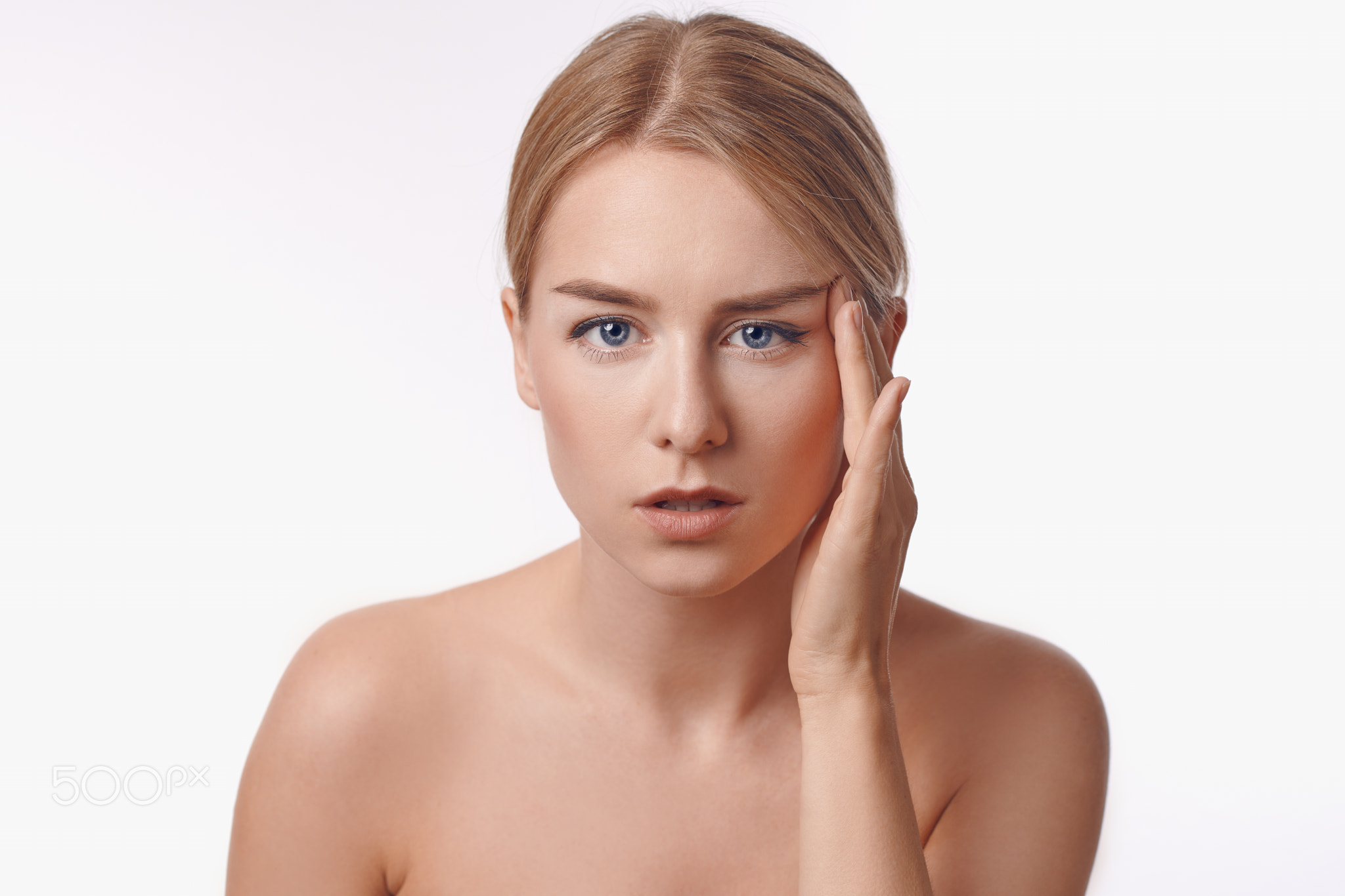 Portrait of a sexy blond woman frowning