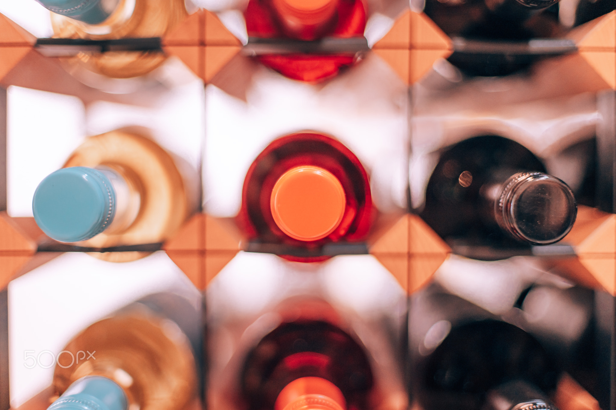 wine bottles in a large rack in a wine cellar
