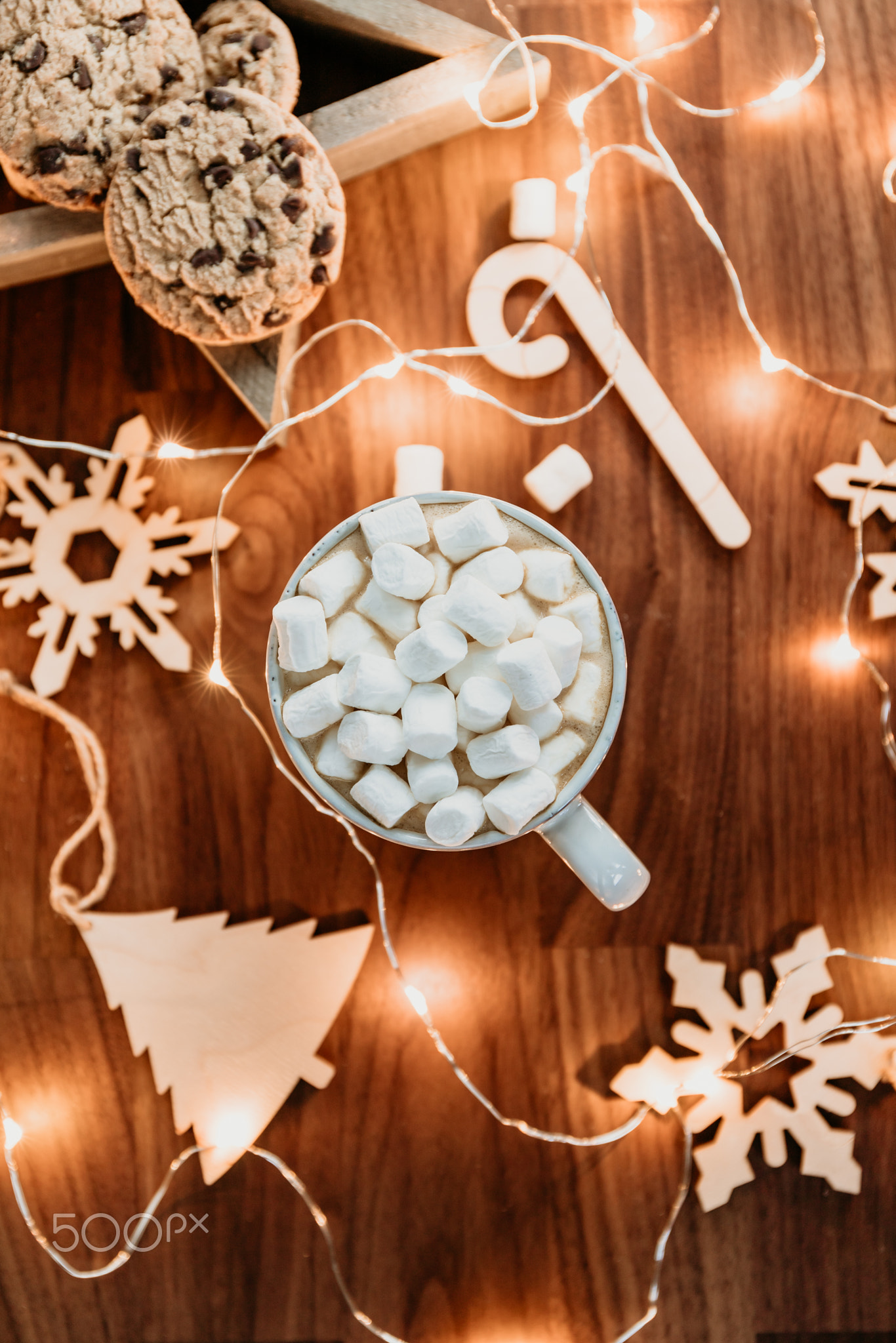 Cosy Christmas or New Year  flat lay. Hot chocolate with marshmallow in a white ceramic mug among wi