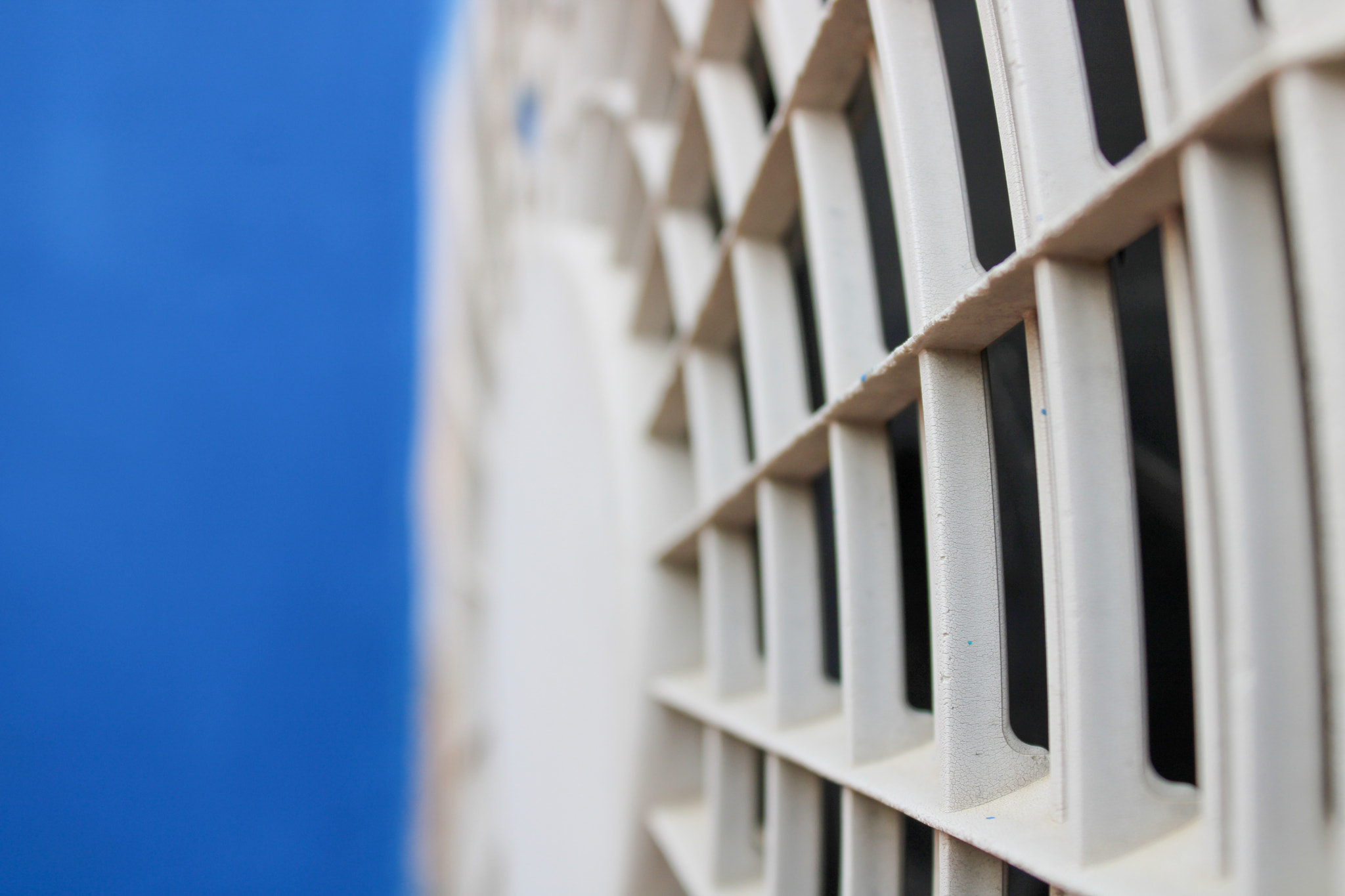 Compressor of an air conditioner with a blue background