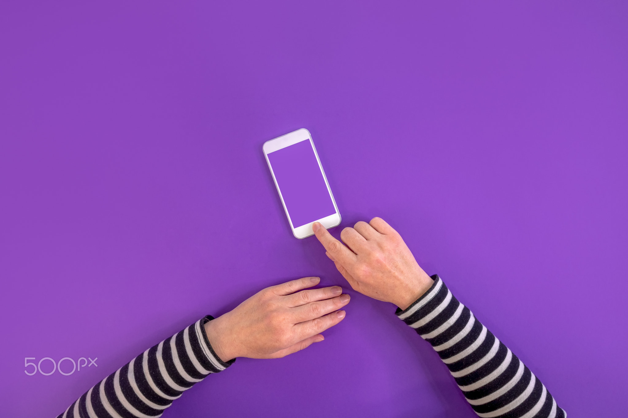 Smartphone in female hands mock up top view