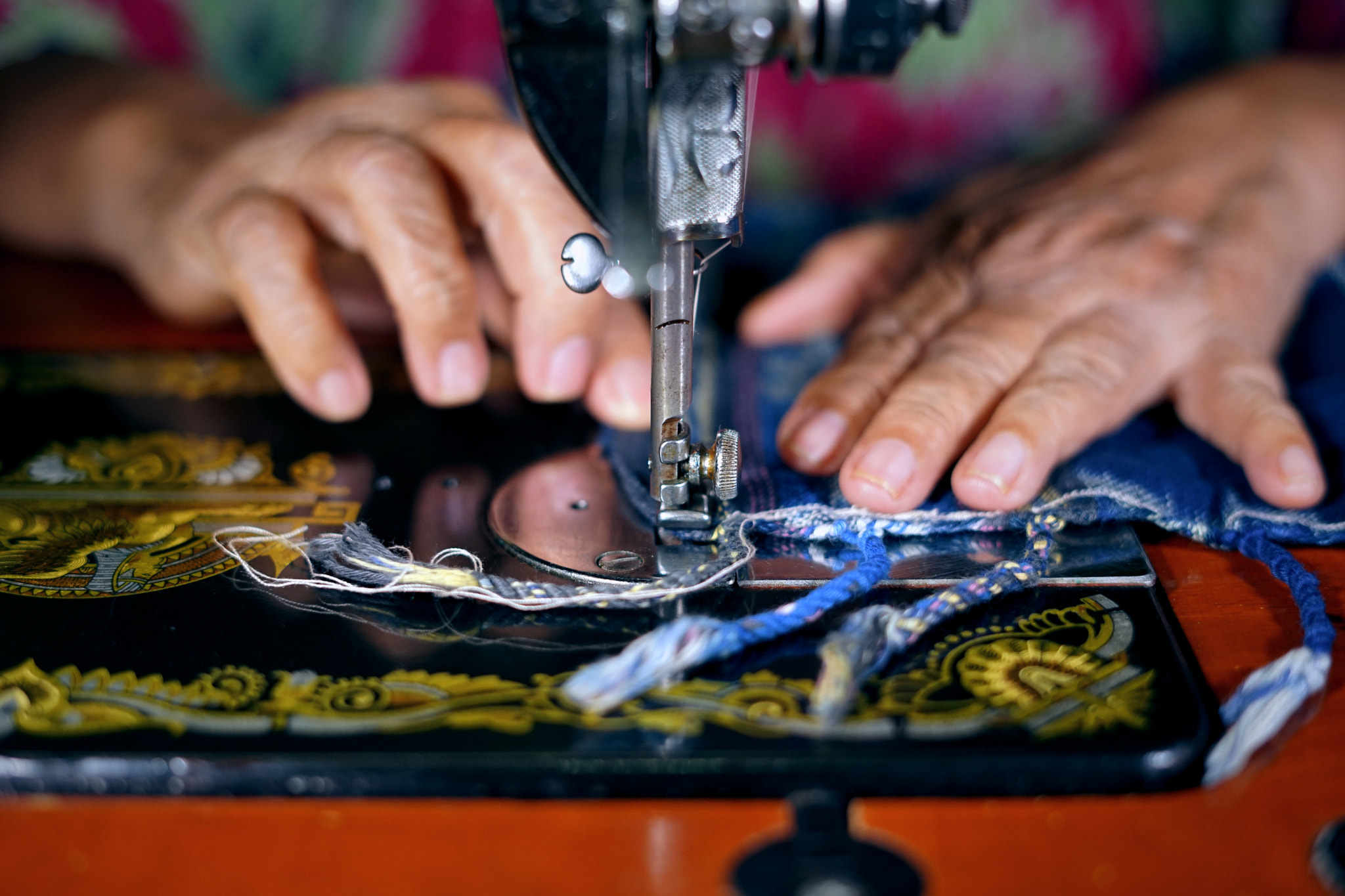 Close up woman hands sewing Traditional prayer mat