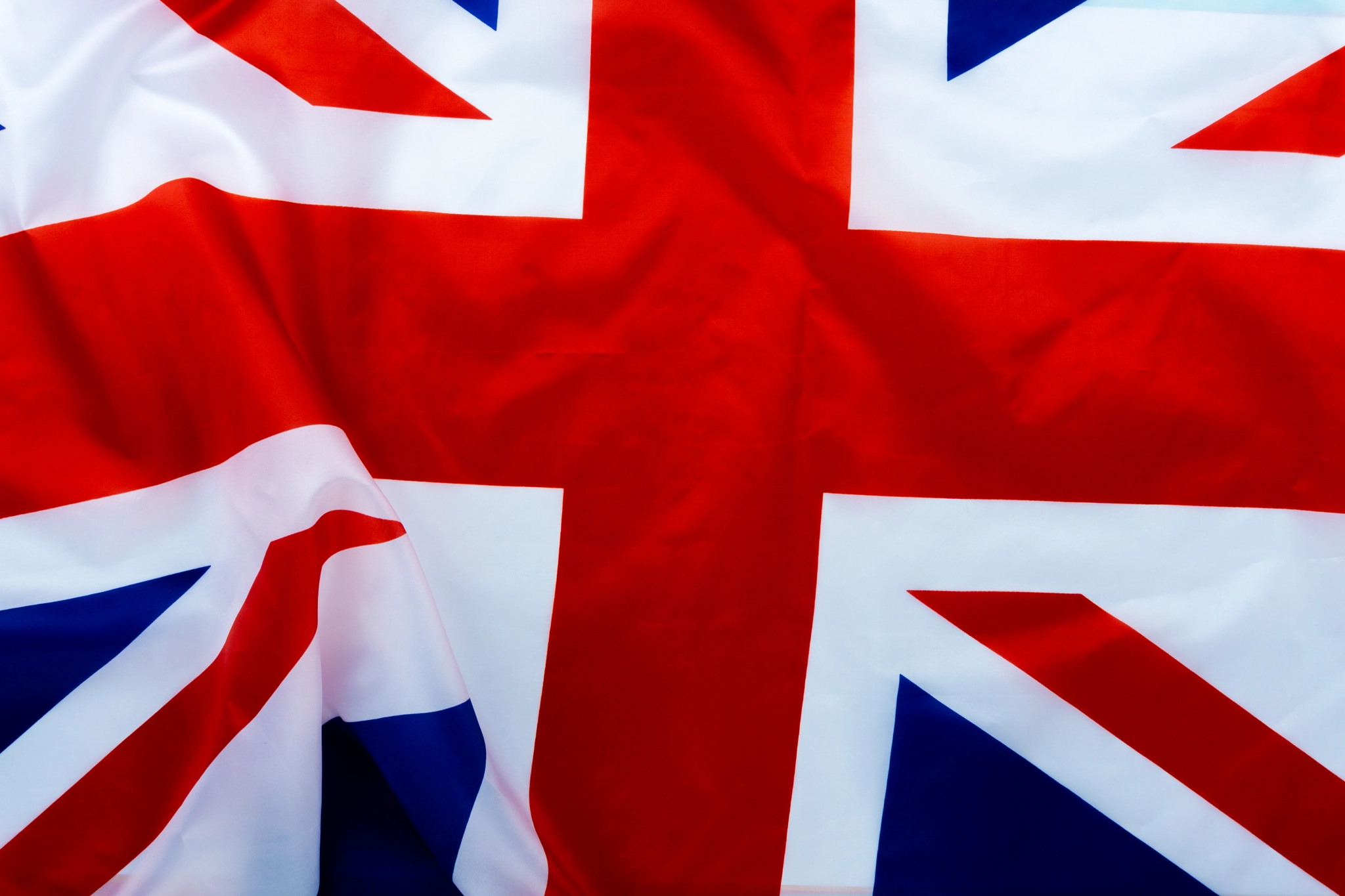 Flag of UK, British flag, close up. Top view, copy space for tex