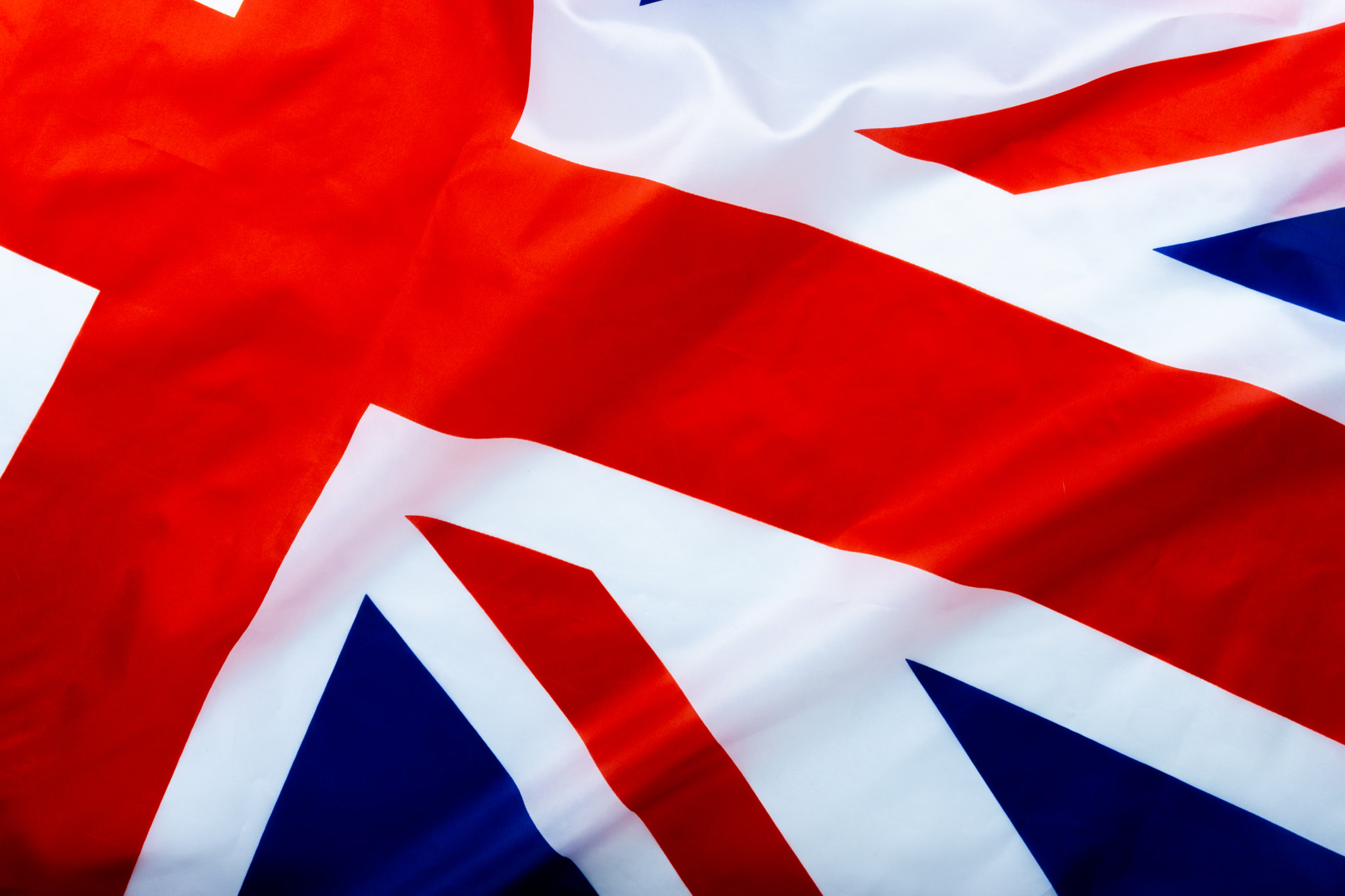 Flag of UK, British flag, close up. Top view, copy space for tex