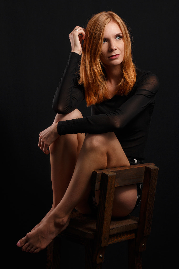 Portrait of young and sexy redhead girl sitting on a chair in da by Egor Milogrodskiy on 500px.com