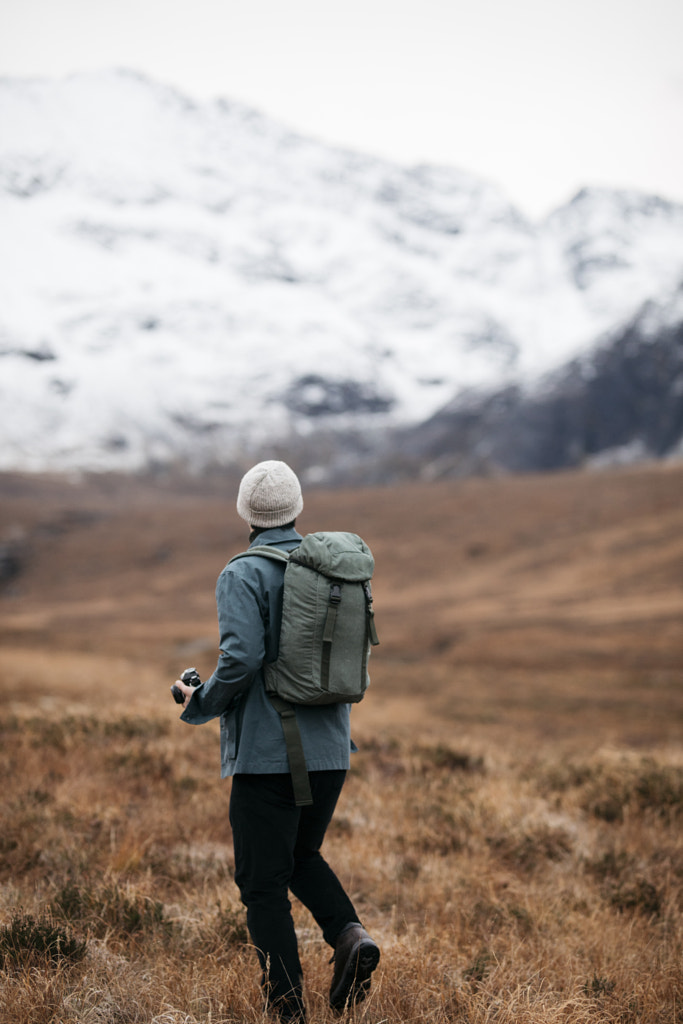 Man exploring outdoor snowy mountains with backpack by Cameron Prentice on 500px.com