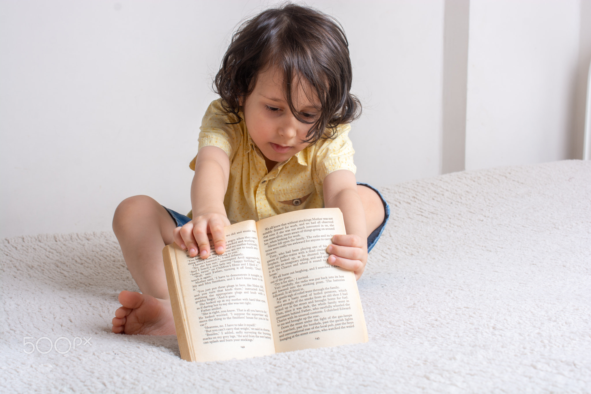 Boy holding book as World book day concept