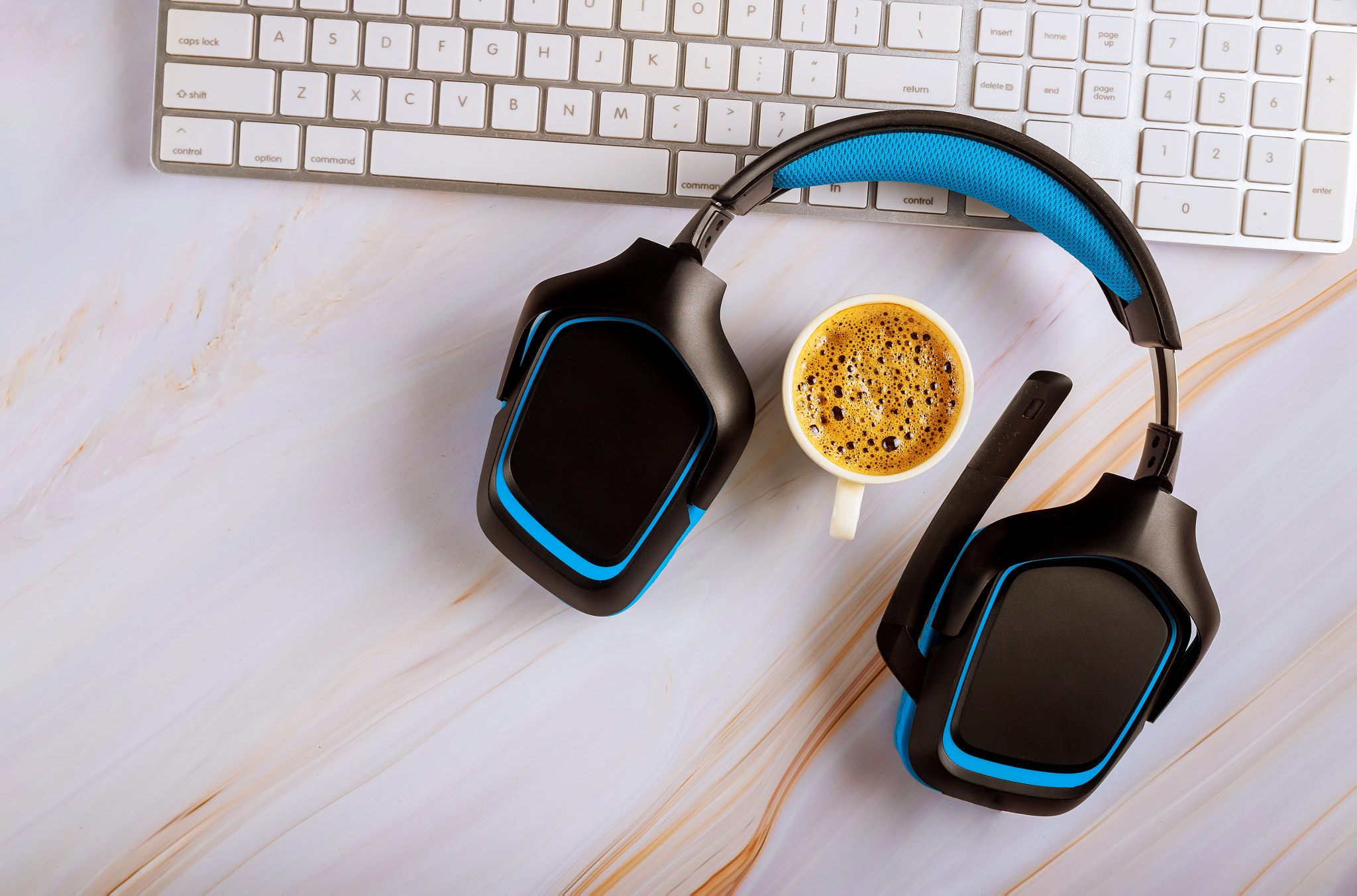 Office desk with headset call center manager desktop on cup of coffee top view white background