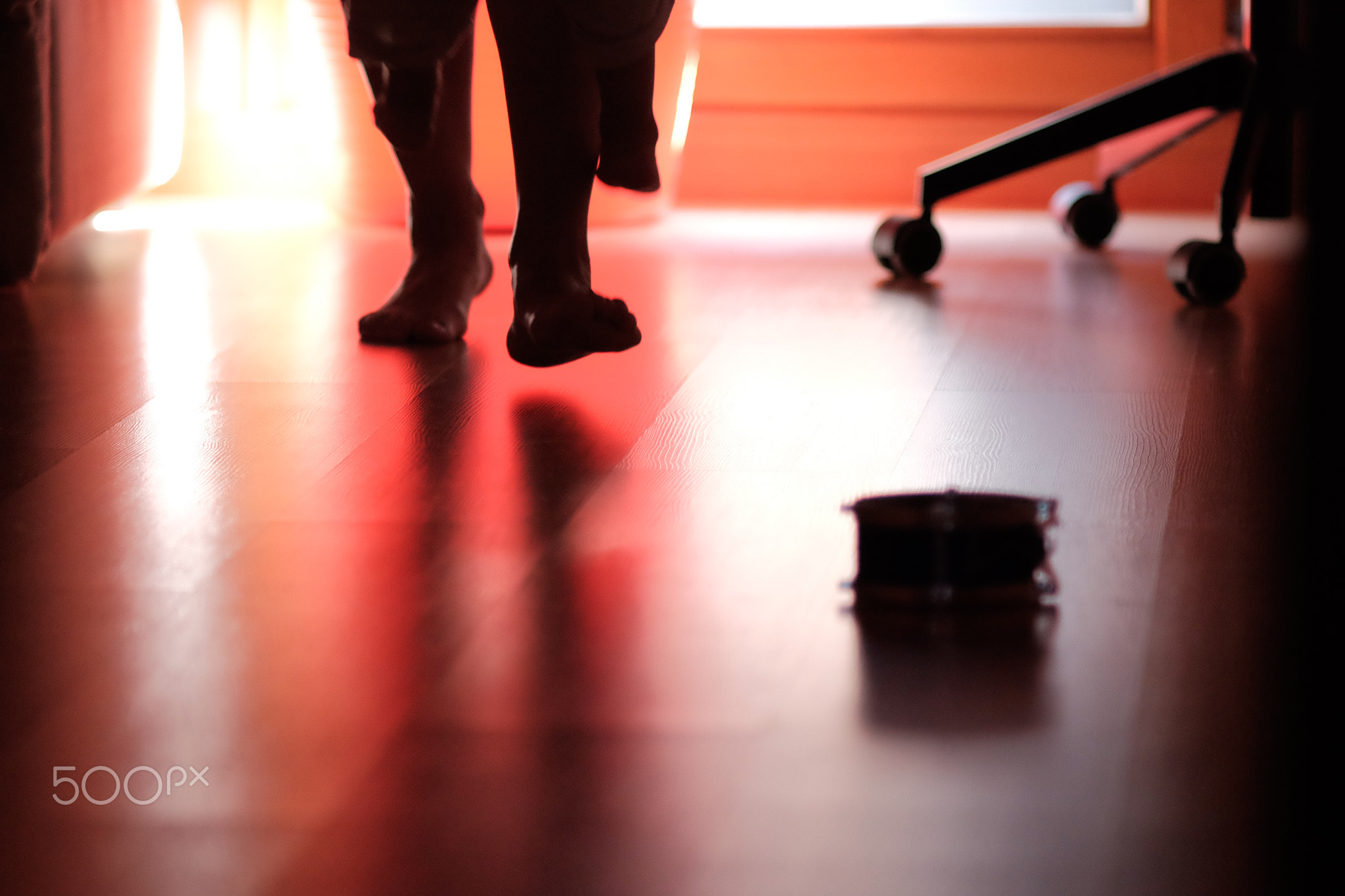 Mother and children barefoot playing at home