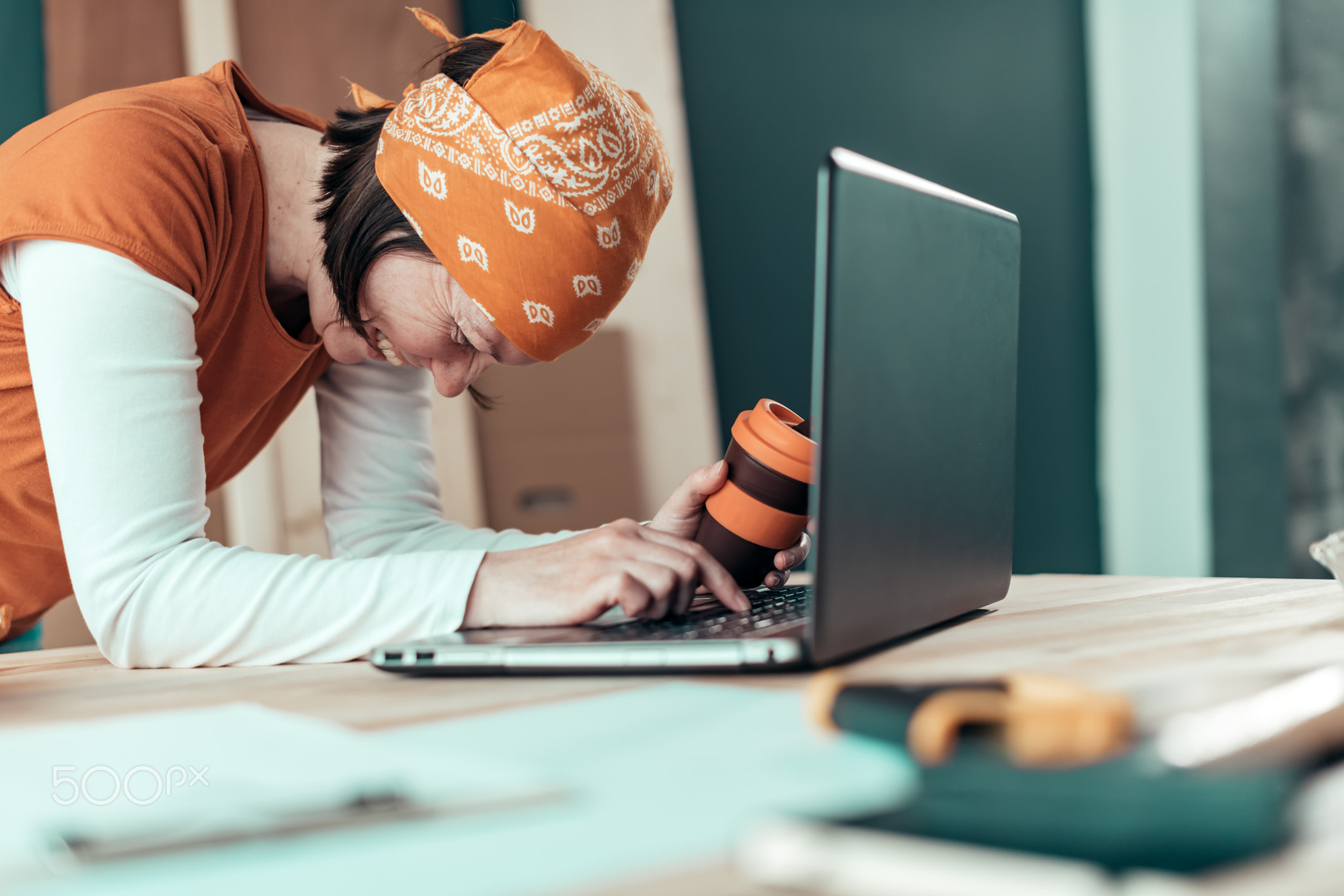 Happy smiling female carpenter during online chat