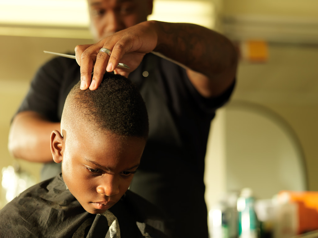 little boy getting hair cut by barber by Joshua Resnick on 500px.com