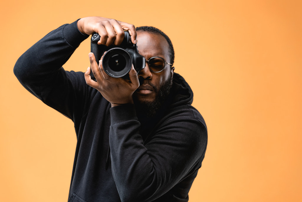 Portrait of beard African American professional photographer  by Alexander Shelegov on 500px.com