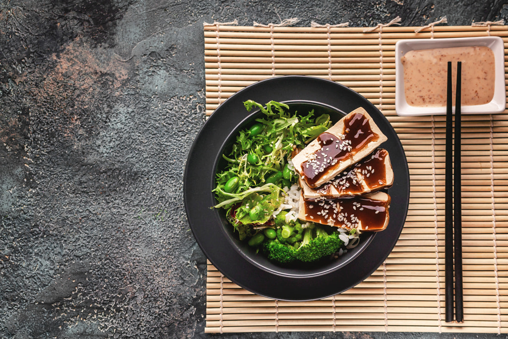 Pan-Asian cuisine. Tofu with teriyaki sauce. Top view. Copy space by Yuri Sevryuk on 500px.com