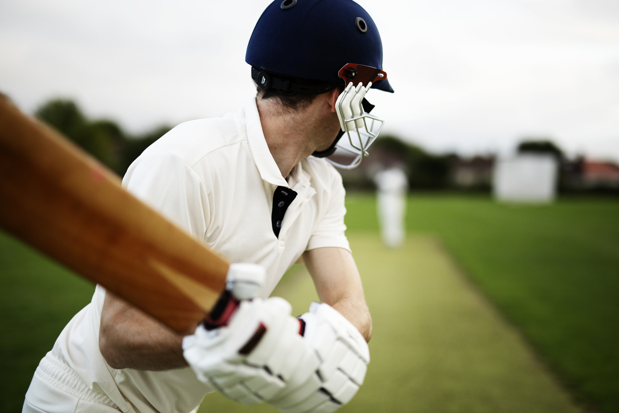 Cricketer on the field in action