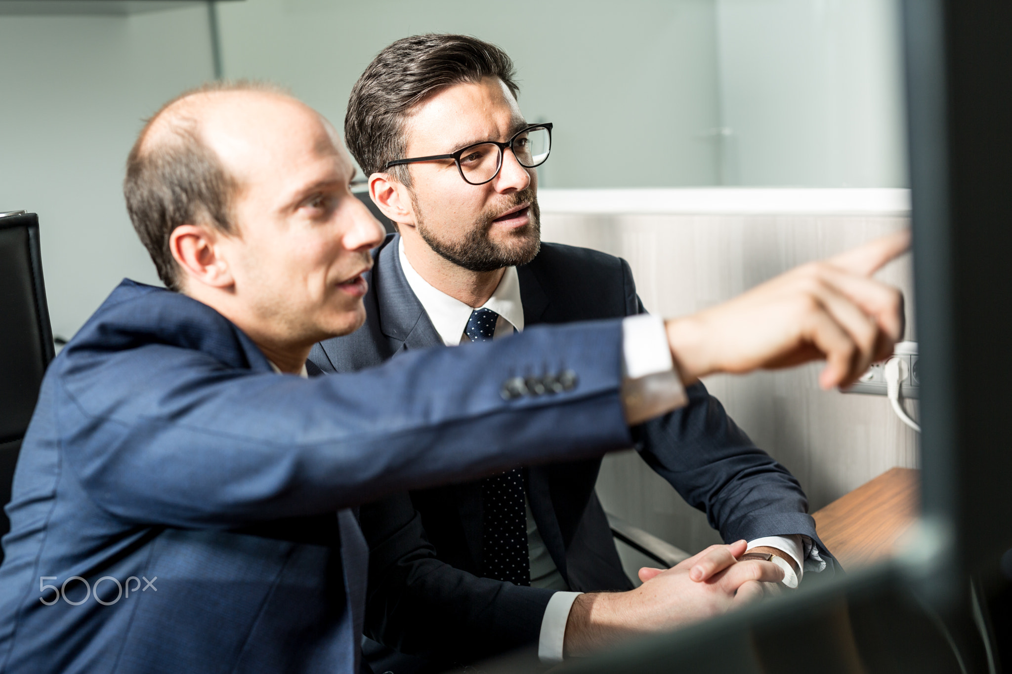 Business team analyzing data at business meeting in modern corporate