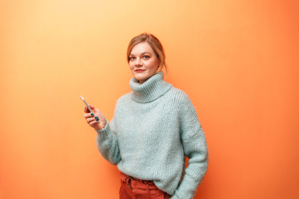 portrait of a young woman with smartphone by Denis Ganenko on 500px.com