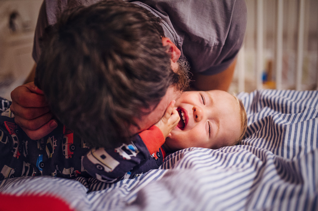 A close-up of father with toddler child indoors having fun. by Jozef Polc on 500px.com