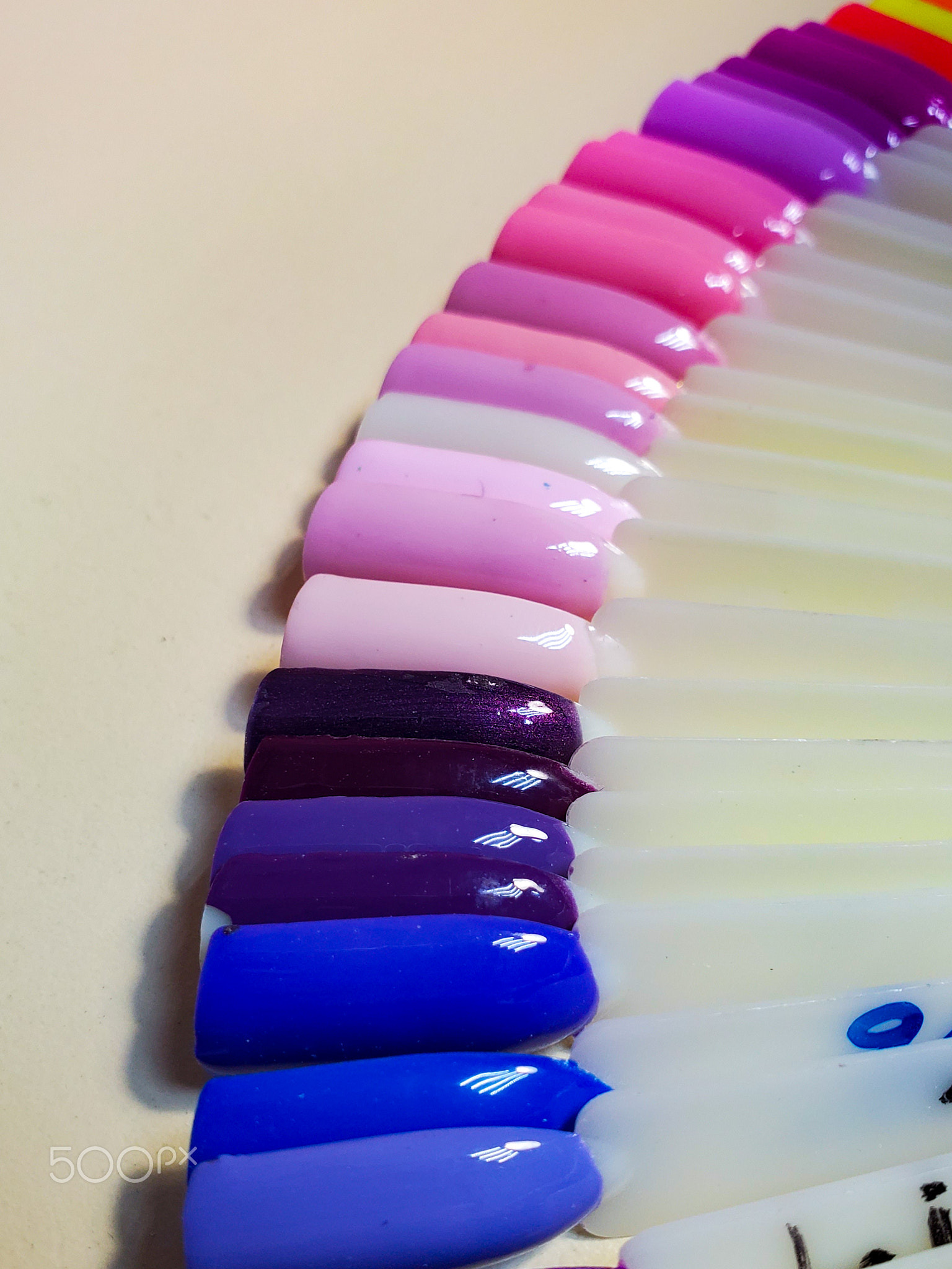 Collection of plastic testers of different shades of nail Polish