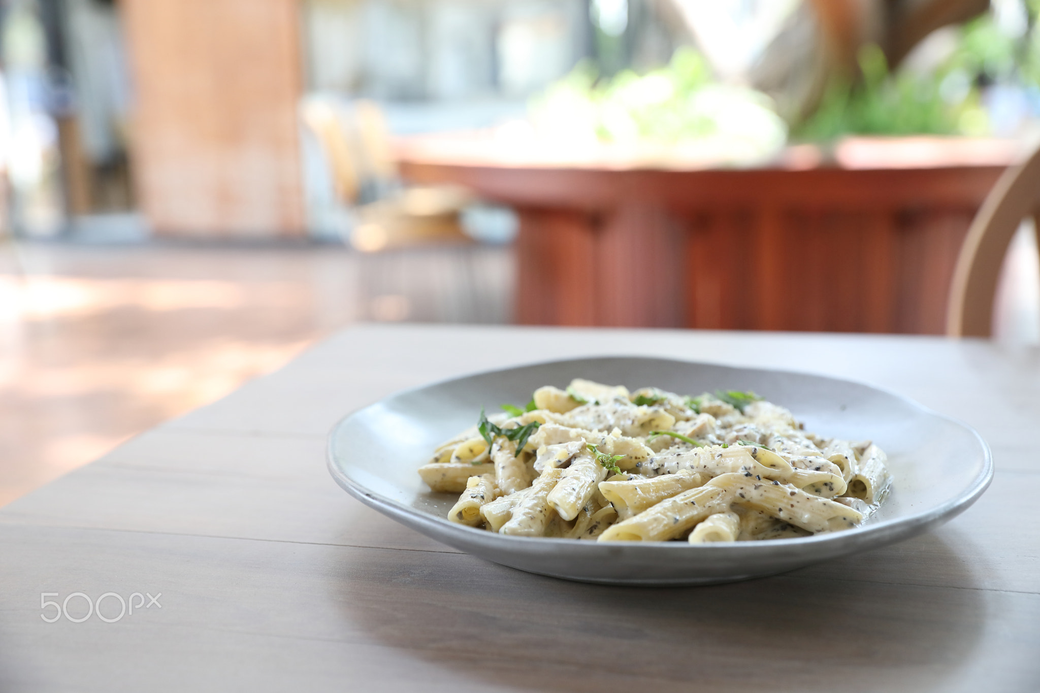 Penne pasta with white sauce and truffle , italian food